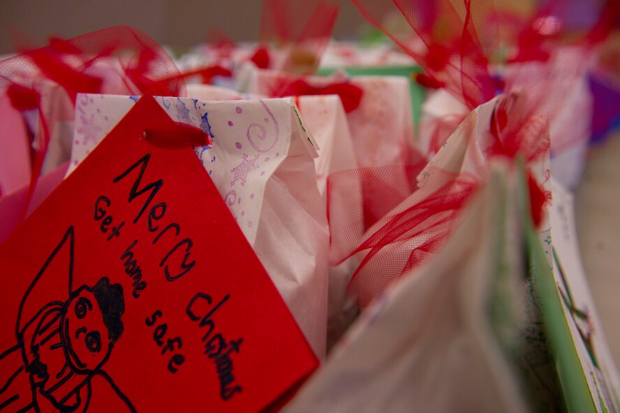 Over 1,800 cookies were packaged for the 2013 annual holiday cookie drive at the Holloman Air Force Base N.M., Base Chapel, Dec. 9. “It’s to give the Airmen who are away from home for the first time a little taste of home during the holiday season,” said Vicki Croft, wife of Col. Andrew Croft, 49th Wing commander. Members of Team Holloman and the local community baked cookies for Airmen living in the dorms to bring a little taste of home to those who might not be able to see their family over the holidays. (U.S. Air Force photo by Airman 1st Class Chase Cannon/Released)