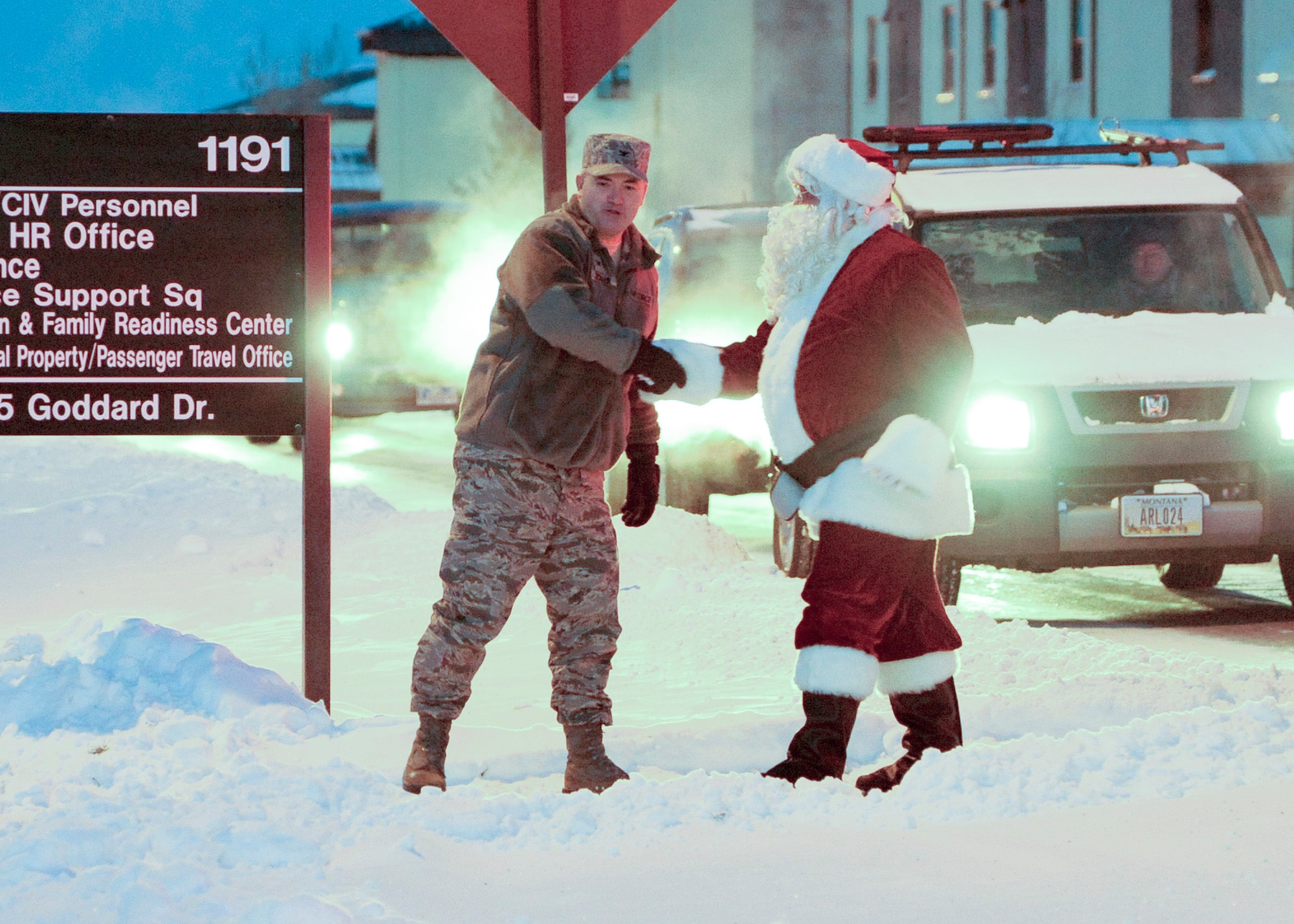 Col. Mark Schuler, 341st Operations Group commander, greets Santa Claus at the tree-lighting ceremony held at Bldg. 1191 on Dec. 5. Airmen and dependents gathered around the tree to watch Schuler and Santa Claus turn on its decorative lights before heading to the Grizzly Bend for a small holiday kick-off celebration. (U.S. Air Force photo/Senior Airman Cortney Paxton)