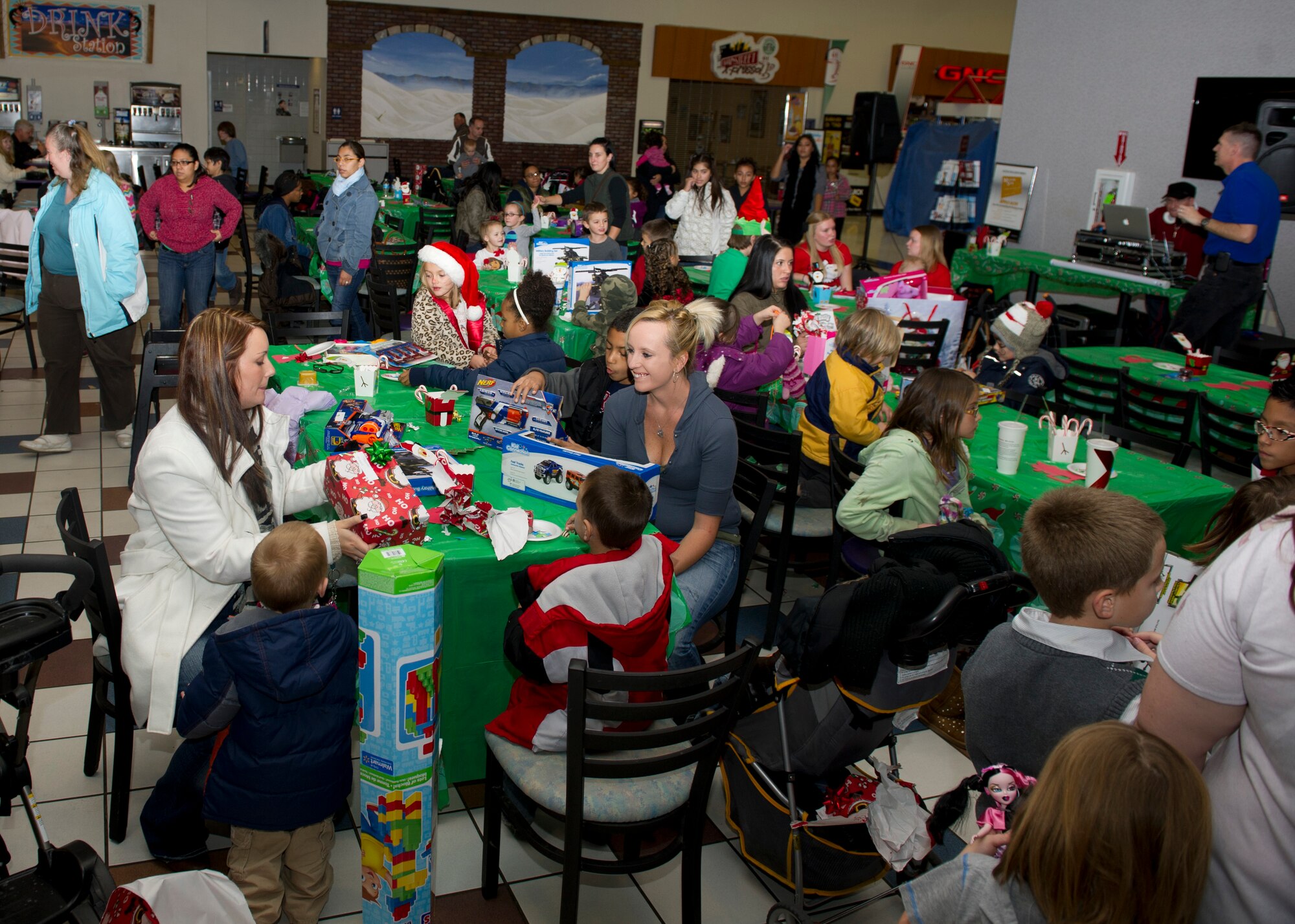 Families of deployed and remote military members were invited to the Base Exchange for their children to meet Santa Claus and enjoy a free holiday meal for the annual Jingle Bell Banquet at Holloman Air Force Base N.M., Dec. 7. This event was a joint community effort with the Exchange, the Airman and Family Readiness Center, the German Air Force, the Key Spouses of the 6th Reconnaissance Squadron, the Test Group, the 4th Space, Materiel Maintenance Squadron and gift donations from David Overstreet, owner of Overstreet Taekwondo in Alamogordo, N.M. 