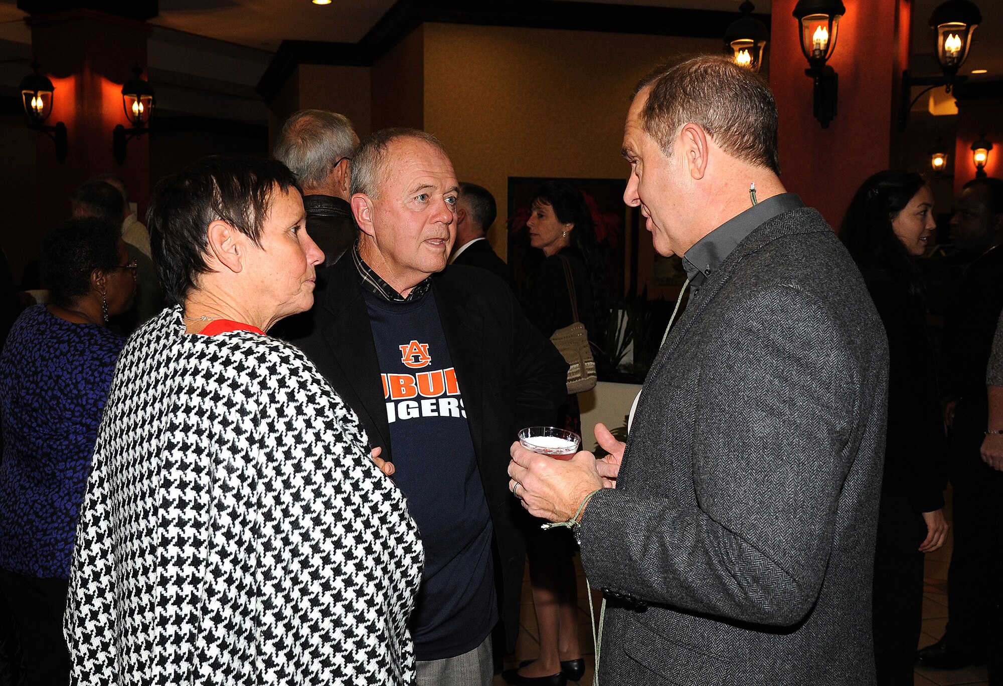 Wendy Corley looks on as former 908th vice commanders Brig. Gen. Robert Corley (ret.), center, and Brig. Gen. Norman Ham, currently serving as a special assistant to the commander of the 22nd Air Force, discuss their years with the 908th Airlift Wing during the unit's 50th Anniversary Celebration Saturday.
(Air Force photo by Lt. Col. Jerry Lobb)