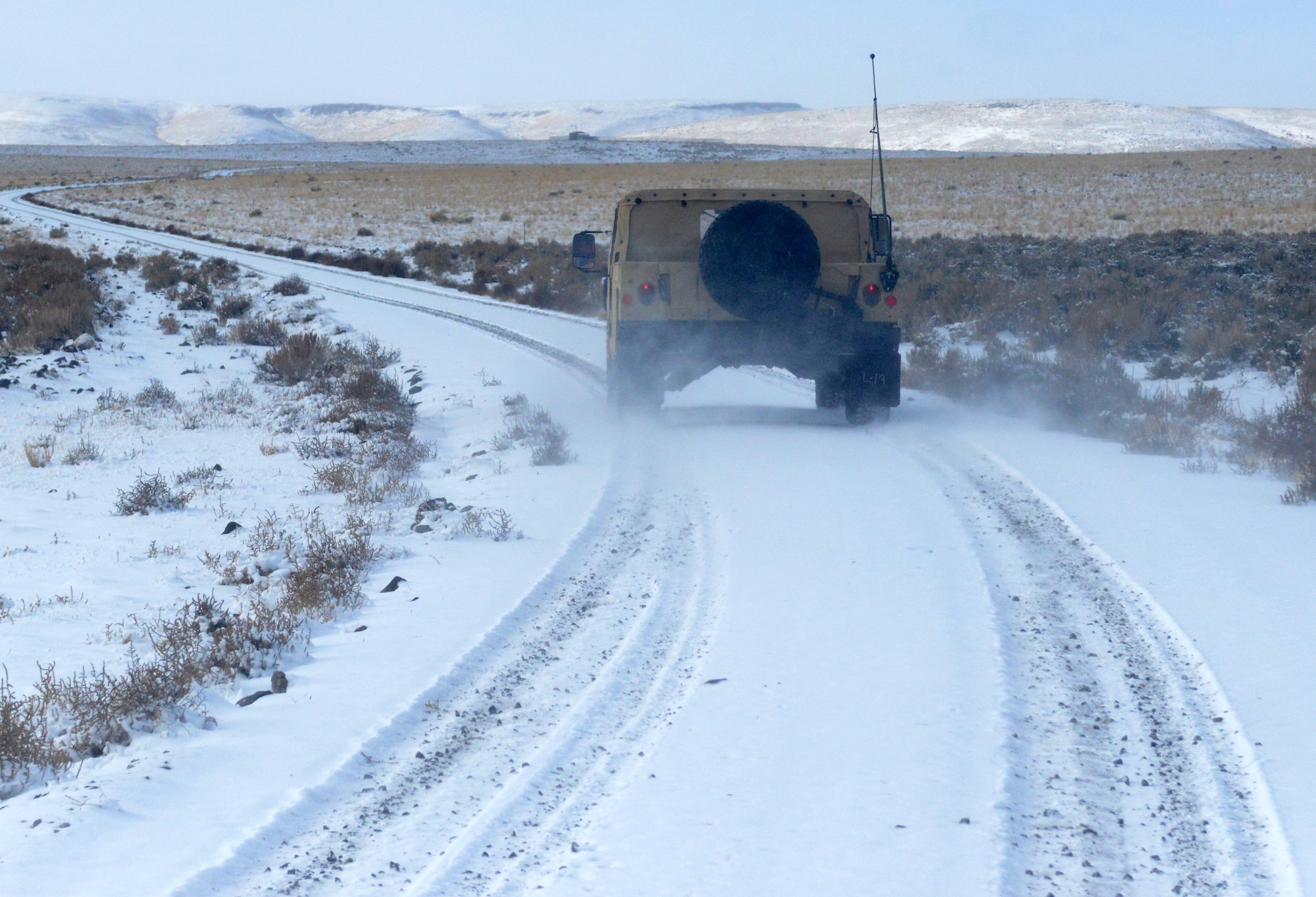 A humvee drives to a training site during the Convoy Operations Readiness Training, Dec. 6, 2013, near Mountain Home Air Force Base, Idaho. 366th Logistic Readiness Squadron vehicle operators are trained on a variety of skills to include emergency vehicle repairs. (U.S. Air Force photo/Senior Airman Caitlin Guinazu/Released)