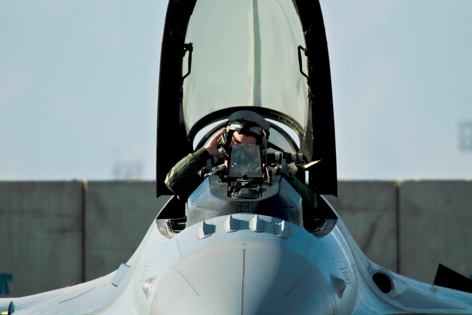 U.S. Air Force Capt. Brian Bradke, deployed with the 119th Expeditionary Fighter Squadron, New Jersey Air National Guard, prepares his F-16C Fighting Falcon for a combat mission in support of coalition forces on Dec. 21, 2011.  (U.S. Air National Guard photo by Tech. Sgt. Matt Hecht/Released)