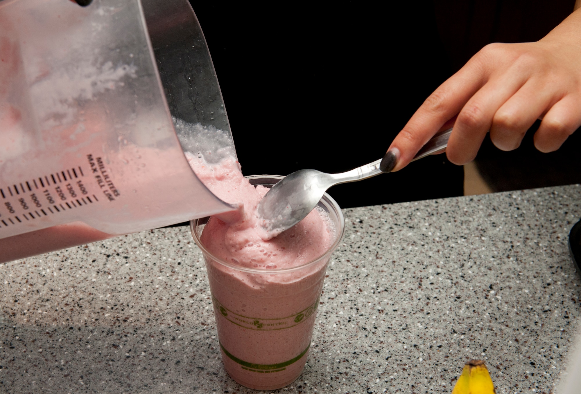 Katie Ishmael, director of the Refuel Café pours a smoothie for a customer at the Refuel Café at Holloman Air Force Base, N.M., Dec. 8. The Refuel Café is sponsored by YMCA armed forces of El Paso, Texas. The café offers free wi-fi, cable, and, of course, coffee. The Refuel Café is open Fridays and Saturdays from 6 p.m. to10 p.m. and Sundays 5 p.m. to 9 p.m. (U.S. Air Force photo by Senior Airman Colin Cates/Released)