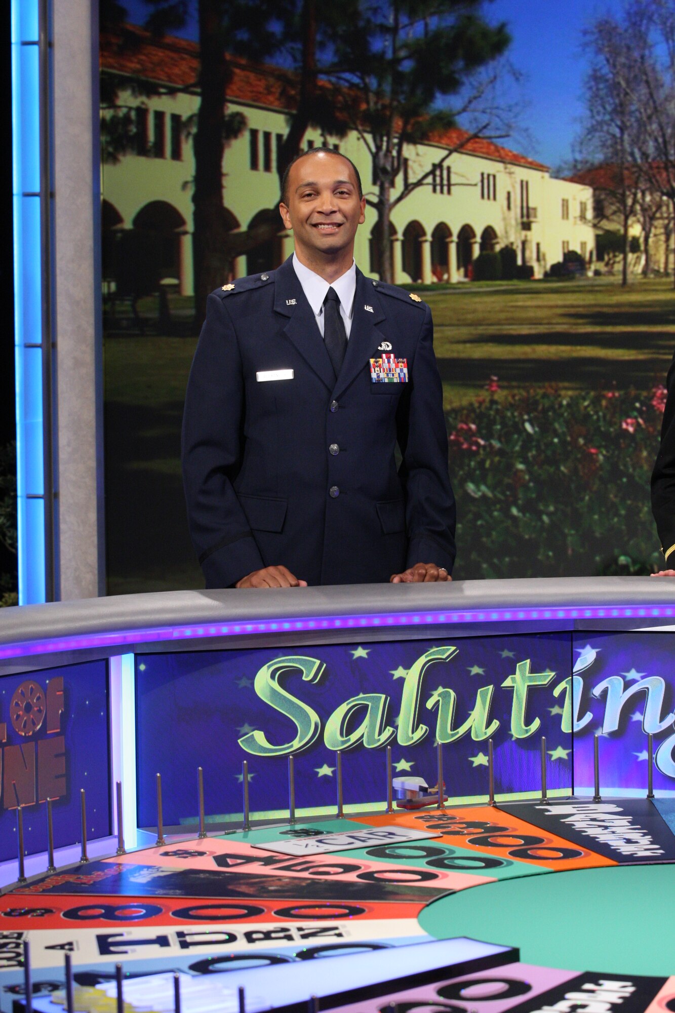 Maj. Jeremy Alexander, 15th Operational Weather Squadron director of operations stands in front of the Wheel of Fortune at the Los Angeles studio Oct. 4, 2013. Alexander came in second place on the show and came out winning a total value of $13,549. (Courtesy photo / Carol Kaelson)