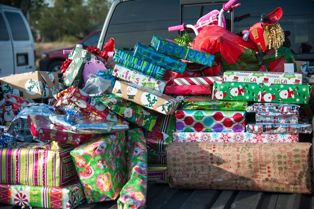 The 47th Student Squadron came together and donated enough gifts to support 37 children. Yanet Darden, pathways family specialist, explained how she has never seen so many gifts donated to these children at the group home. (U.S. Air Force photo/2nd Lt. William M. Tyrrell)