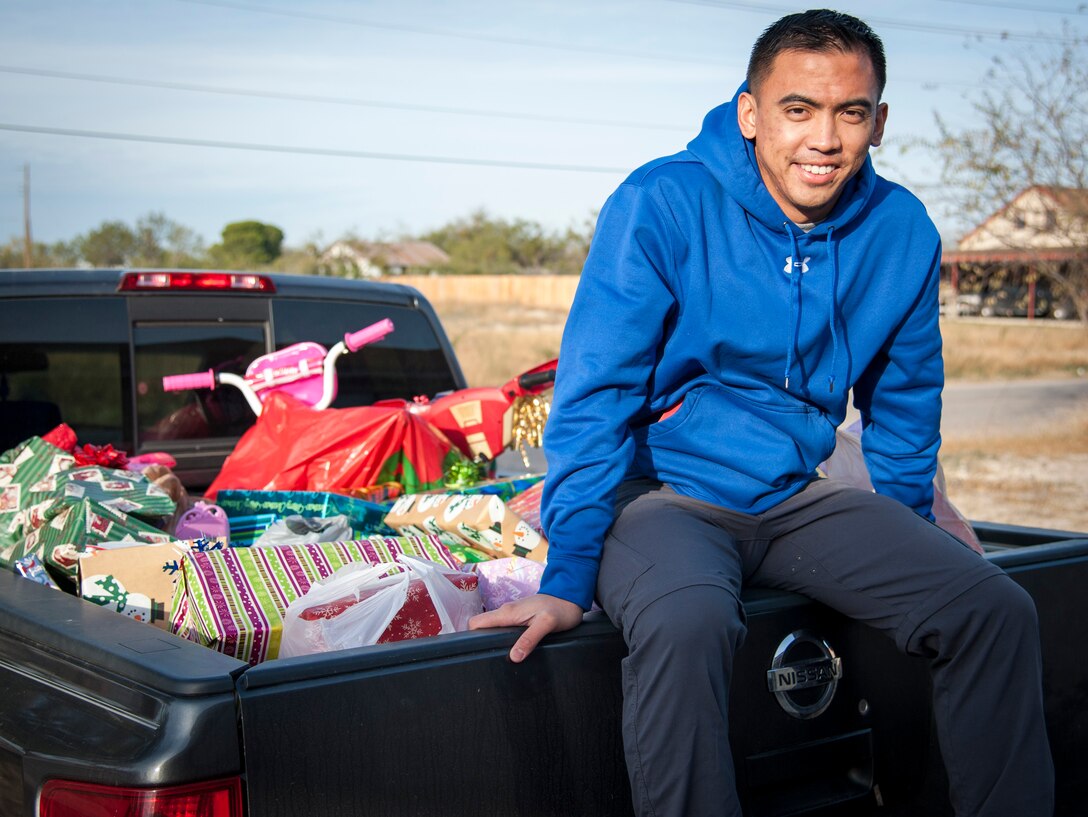 Second Lt. Nico Gigante, 47th Student Squadron student pilot, loaded his truck, inside and out, which was about to be donated to the pathways group home. With the help of the 47th STUS, Gigante was able to raise about $1,500 worth of presents.  (U.S. Air Force photo/2nd Lt. William M. Tyrrell)