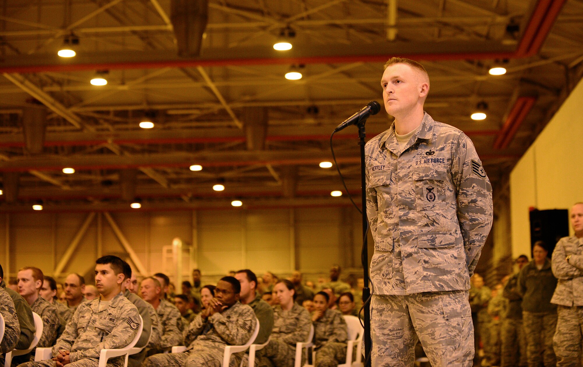 Staff Sgt. Joshua Heffley, 31st Security Forces Squadron team member, asks Army Gen. Martin Dempsey, Chairman of Joint Chiefs of Staff, a question during an all call at Aviano Air Base, Italy, Dec. 11, 2013. The all-call was intended to answer all Airmen’s questions about recent changes such as resiliency overseas, budgetary constraints and physical fitness policy revisions. (U.S. Air Force photo/Senior Airman Matthew Lotz)