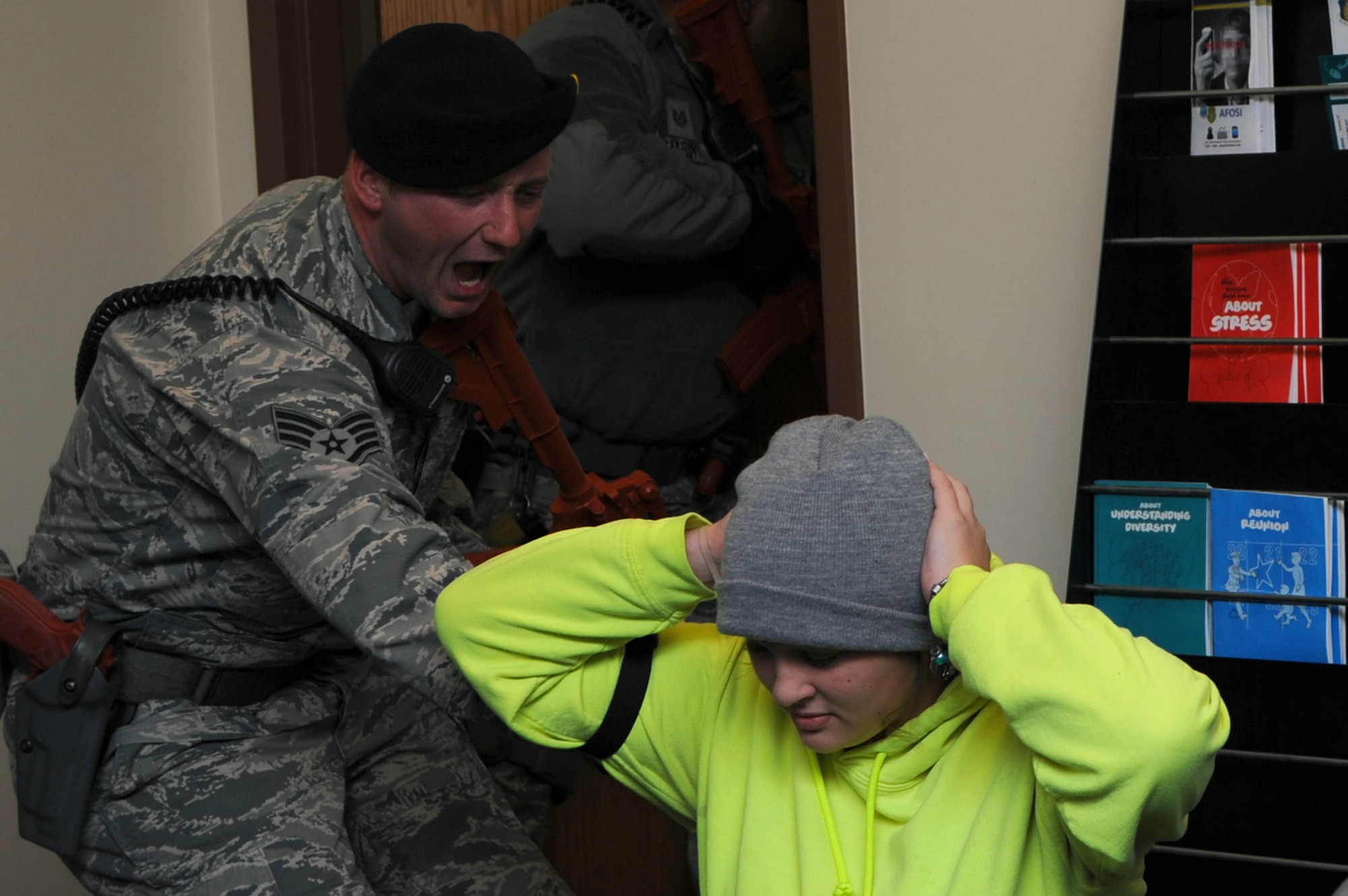 ALTUS AIR FORCE BASE Okla. – U.S. Air Force Staff Sgt. Arthur Hanus, 97th Security Forces Squadron response force leader, orders an Airman to get on the ground during an active-shooter exercise Dec. 11, 2013. The exercise tested first responders’ abilities to effectively and efficiently respond to an active-shooter incident.  (U.S. Air Force photo by Airman 1st Class Klynne Pearl Serrano/Released)