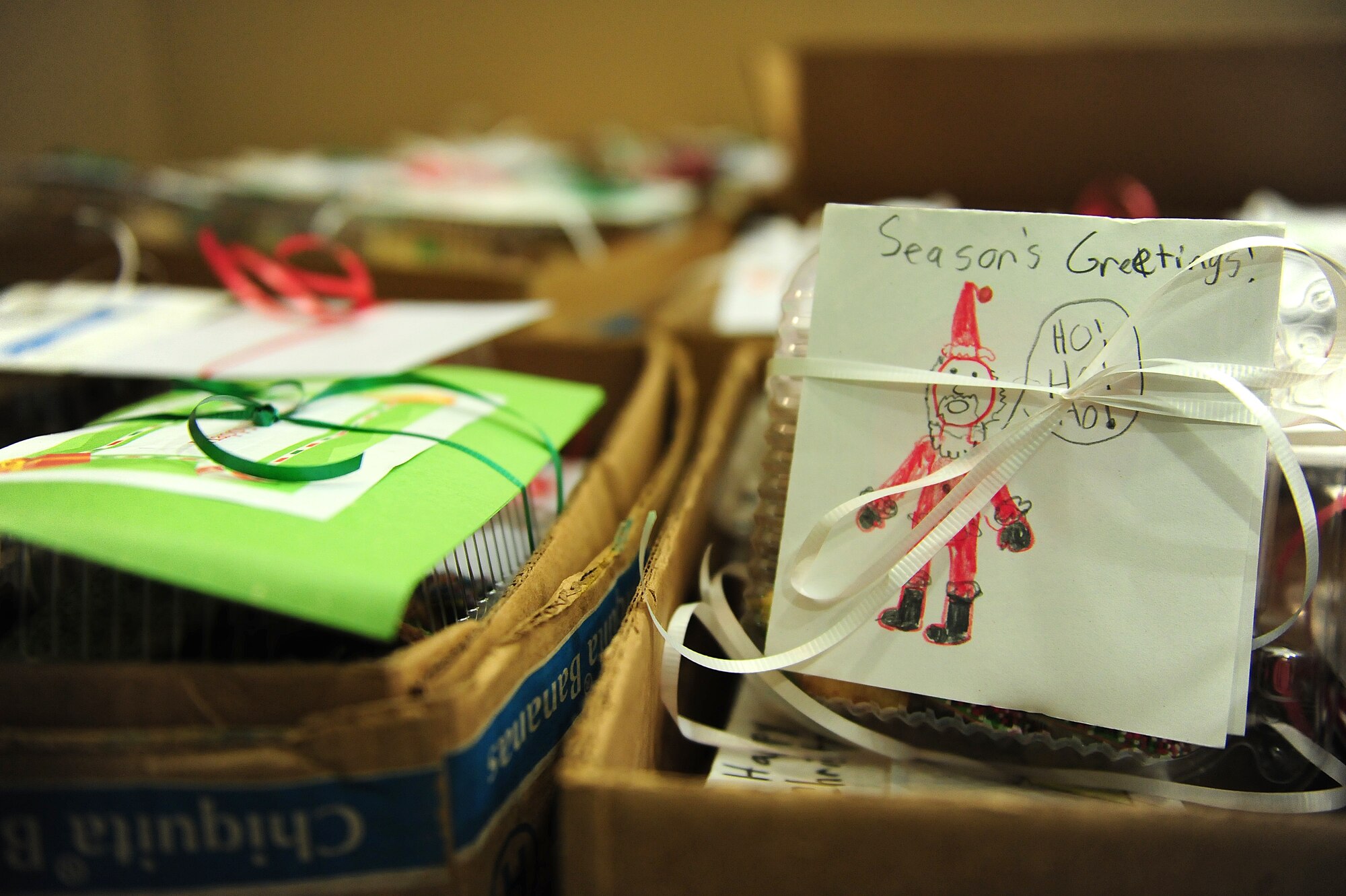 Volunteers from the Officer and Civilian Spouses’ Club, a private organization which helps military spouses get involved with the base community, packaged cookies for the annual Airmen Cookie Drive at Seymour Johnson Air Force Base, N.C., Dec. 10, 2013.  The club collected and packaged thousands of cookies and will partner with the First Sergeant’s Association to distribute them to about 550 Airmen living in the dorms.  (U.S. Air Force photo by Airman 1st Class Brittain Crolley)