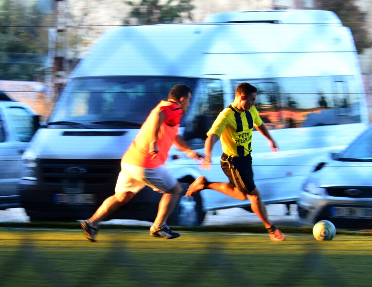 Airman 1st Class Adrien Rivera, 39th Communications Squadron, attempts a kick towards the goal during a soccer match Dec. 6, 2013, at Adana, Turkey. The two organizations have been working together on a $700,000 project that will upgrade the infrastructure and capabilities of the internet for residents on Incirlik Air Base.  (U.S. Air Force photo by Staff Sgt. Eric Summers Jr./Released)