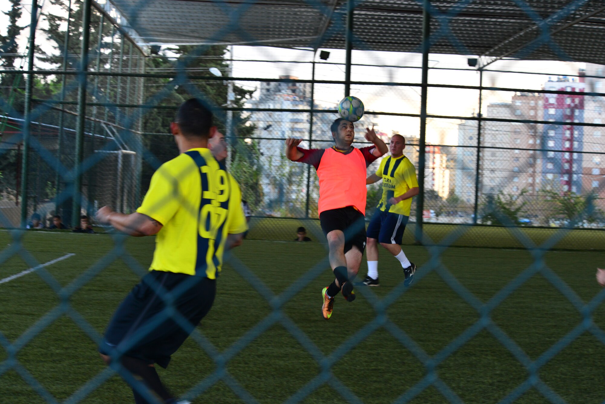 A member of Turkish Telecom head-butts a soccer ball to gain control of it during a soccer game Dec. 6, 2013, at Adana Turkey.  The scrimmage game was a way to build friendly relationships between the two organizations. (U.S. Air Force photo by Staff Sgt. Eric Summers Jr./Released)