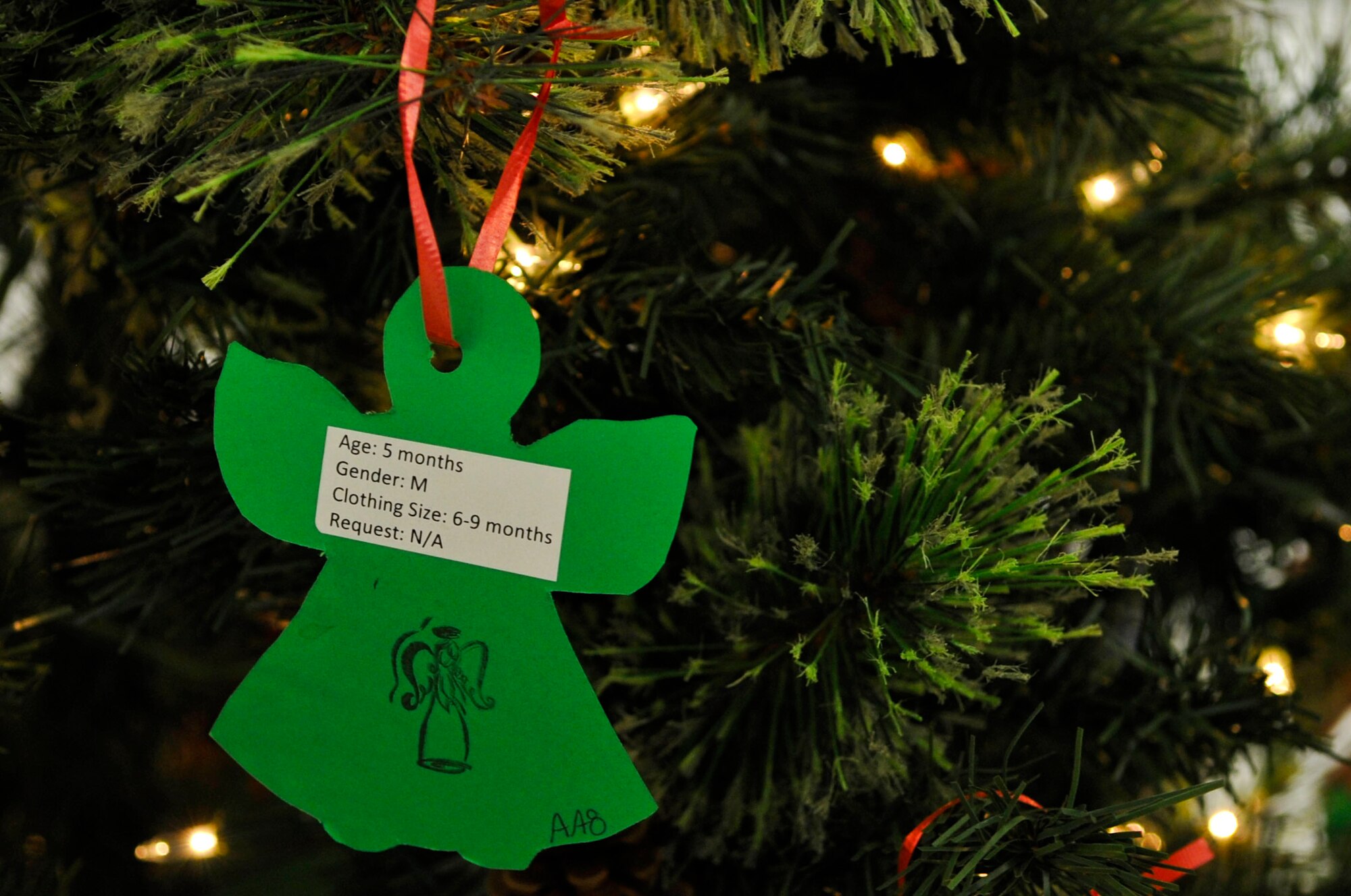 The Angel Tree program, led by the Langley Air Force Base Company Grade Officers Club, provides gifts to Airmen and civilian employees stationed at Langley AFB, Va., that may have had hardships this year making it difficult to provide gifts. This year, the program helped more than 350 families receive gifts for the holiday season. (U.S. Air Force photo by Staff Sgt. Wesley Farnsworth/Released) 