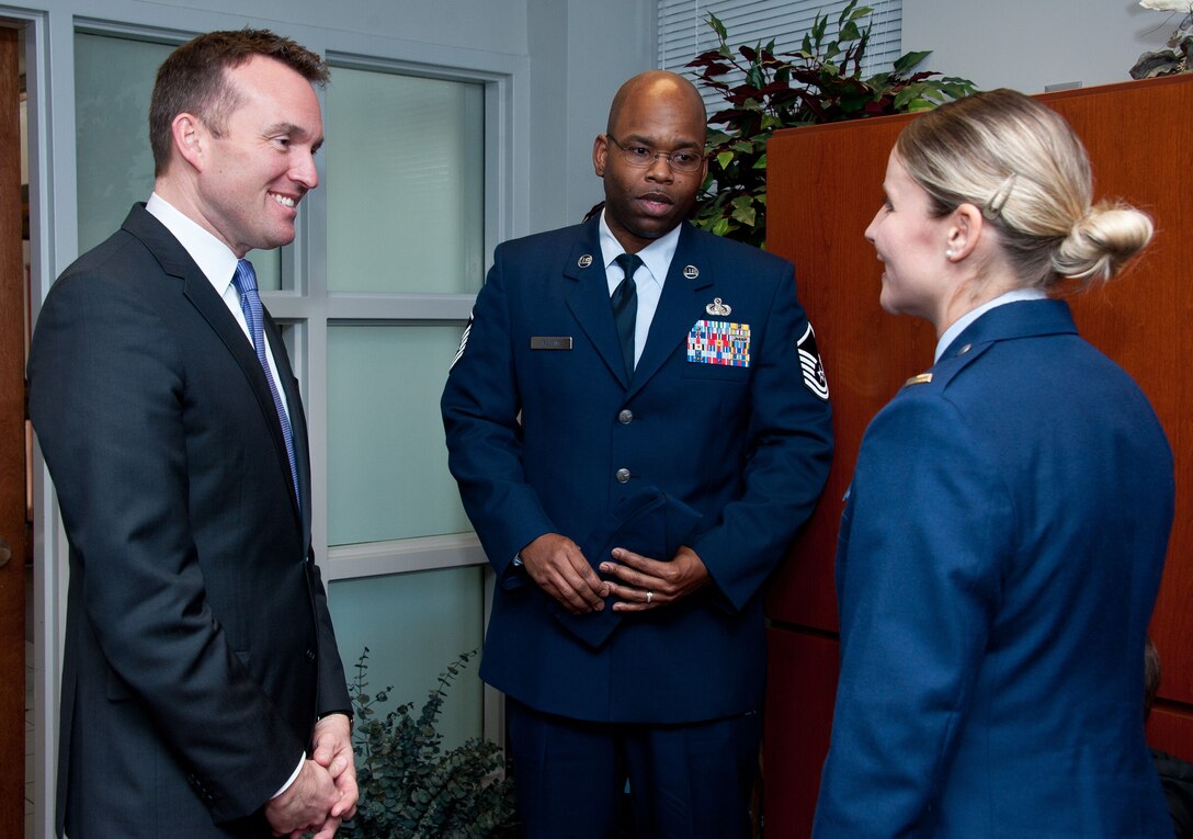 Acting Secretary of the Air Force Eric Fanning meets with officer trainee Lauren Williams and her husband, Master Sgt. Dorian Williams, following her commission to second lieutenant at Maxwell Wednesday. Williams worked in Fanning's office prior to her selection to attend Officer Training School.  This was Fanning's first visit to Maxwell and, in addition to attending the OTS commissioning ceremony and parade, he met with Air University and 42nd Air Base Wing officials and spoke with students from Squadron Officer College, Air Command and Staff College, Air War College and the Air Force Senior Noncommissioned Officer Academy.  (U.S. Air Force photo by Melanie Rodgers Cox) 