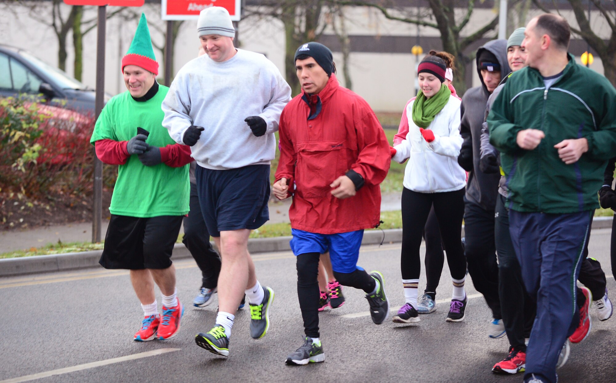 Col. Mark Ciero, 48th Fighter Wing vice commander (far left), and Col. Marc Vandeveer, 48th Mission Support Group commander (next left), lead Liberty Airmen in the 5K Trot for Toys at Royal Air Force Lakenheath, England, Dec. 12, 2013. Airmen who participated in the run donated toys for children who are currently admitted to the West Suffolk Hospital Children’s Rainbow Ward, and the Cambridge University Hospital Children’s Cancer Ward. (U.S. Air Force photo by Airman 1st Class Dawn M. Weber/Released)