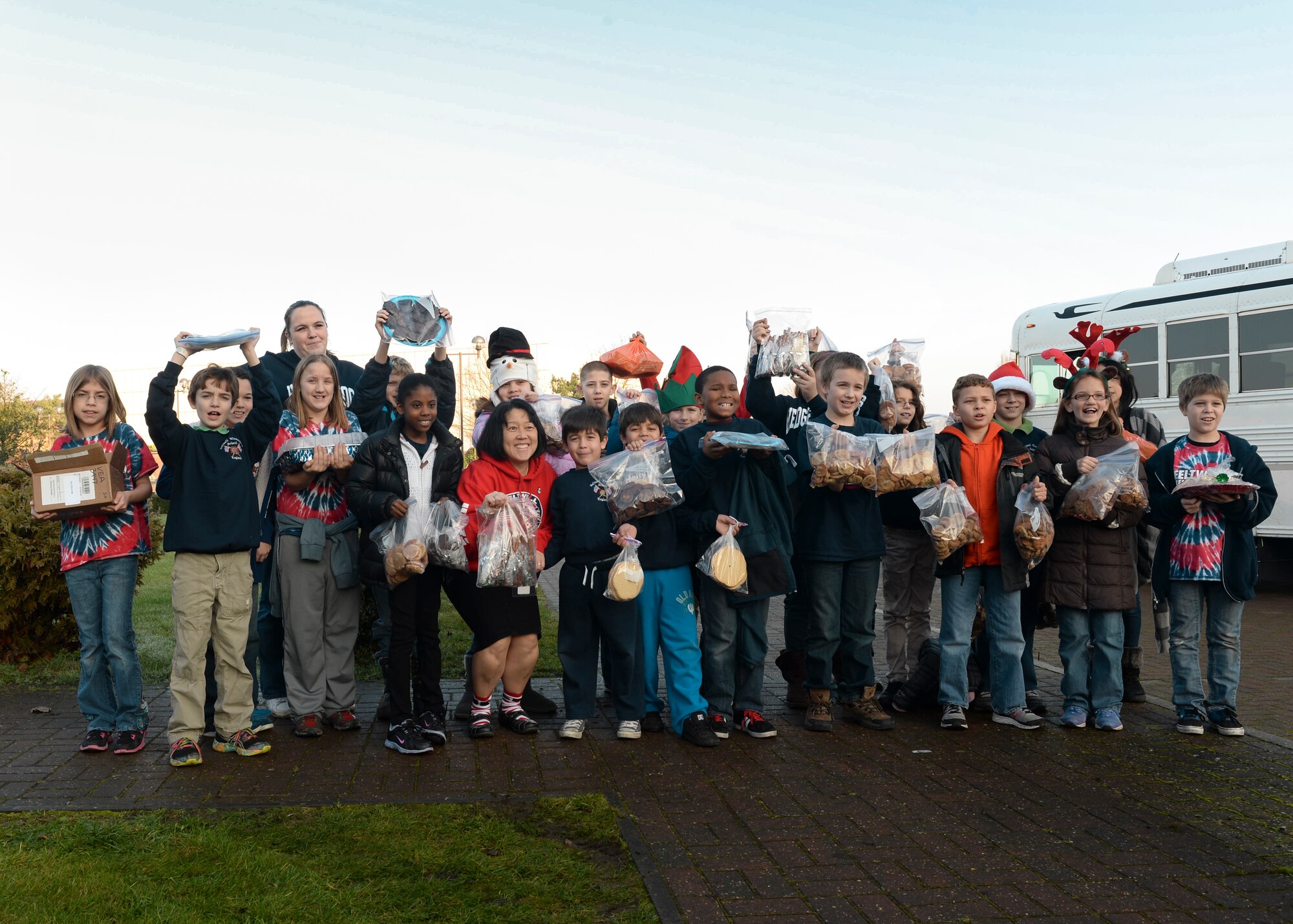 Feltwell Elementary school students made more than 80 dozen homemade cookies for the annual Combat Cookie Drive on Royal Air Force Lakenheath, England, Dec. 11, 2013. The Combat Cookie Drive supplies Airmen who live in the dorms and deployed personnel with a little taste of home during the holiday season. (U.S. Air Force photo by Airman 1st Class Nigel Sandridge/ Released) 