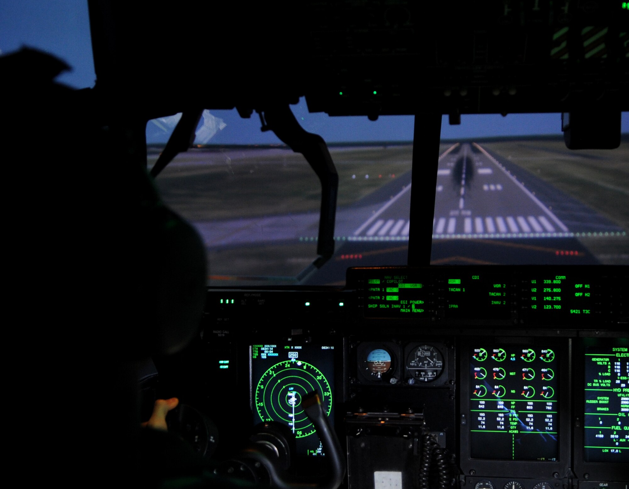 Capt. Michael Hutchins, 19th Operations Group standards and evaluations C-130J chief evaluator, performs a calibration test flight in a C-130J Maintenance and Aircrew Training System simulator Nov. 21, 2013, at Little Rock Air Force Base, Ark. The MATS simulator provides the base Formal Training Unit with top of the line training for mission success. (U.S. Air Force photo by Staff Sgt. Caleb Pierce)