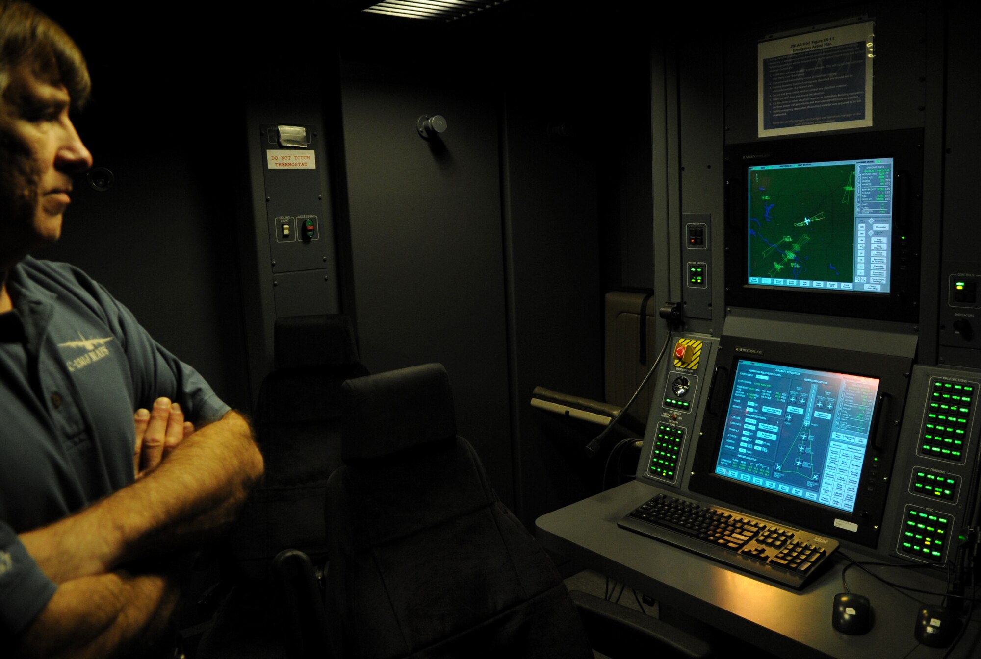 Duke Bender, C-130J Maintenance and Aircrew Training System chief pilot, monitors simulator controls during a calibration test flight Nov. 21, 2013, at Little Rock Air Force Base, Ark. The Lockheed Martin MATS at Little Rock AFB is one of six C-130J training locations for the military. (U.S. Air Force photo by Staff Sgt. Caleb Pierce) 