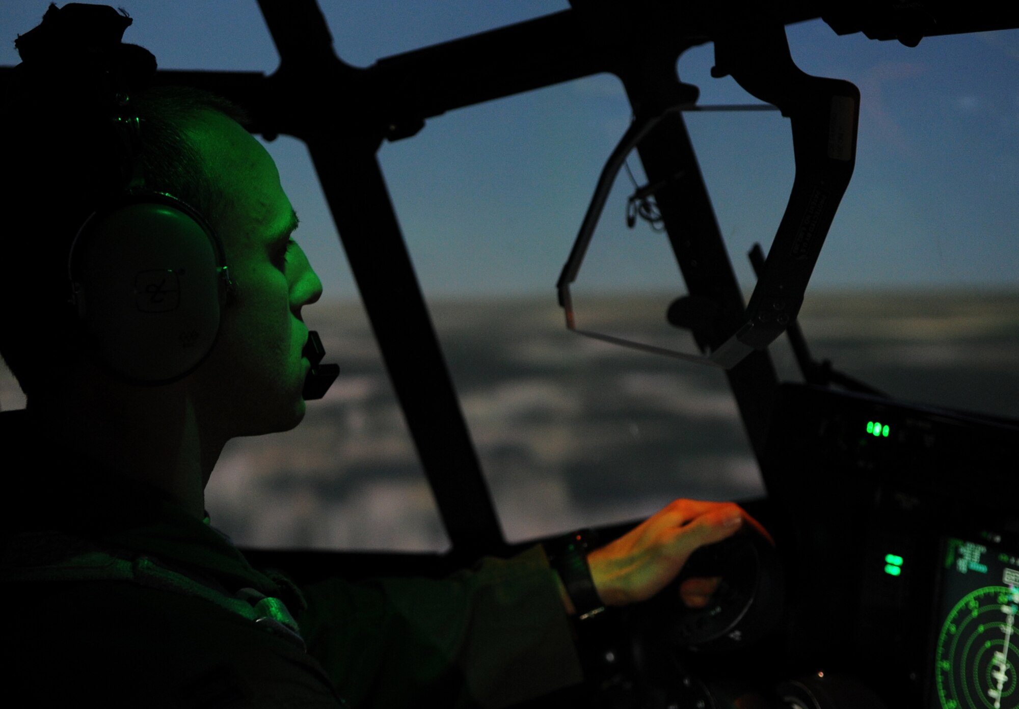 Capt. Michael Hutchins, 19th Operations Group standards and evaluations C-130J chief evaluator, performs a calibration test flight in a C-130J Maintenance and Aircrew Training System simulator Nov. 21, 2013, at Little Rock Air Force Base, Ark. The calibration test included proper and improper maneuvers and operations. (U.S. Air Force photo by Staff Sgt. Caleb Pierce) 