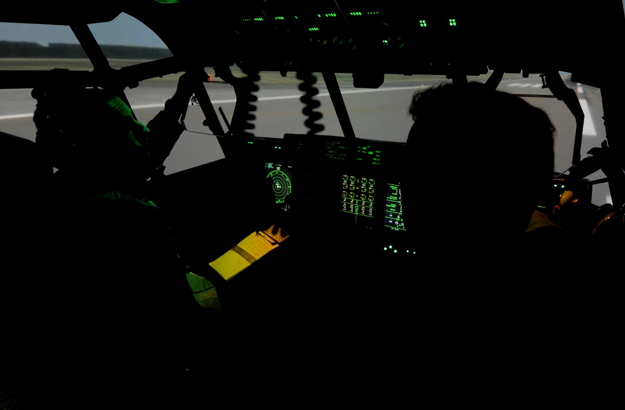Capt. Michael Hutchins, 19th Operations Group standards and evaluations C-130J chief evaluator, and Capt. William Scott, a 41st Airlift Squadron co-pilot, prepare a calibration test flight in a C-130J Maintenance and Aircrew Training System simulator Nov. 21, 2013, at Little Rock Air Force Base, Ark. Calibrations tests are performed to ensure an optimum training environment for the base’s Formal Training Unit. (U.S. Air Force photo by Staff Sgt. Caleb Pierce) 
