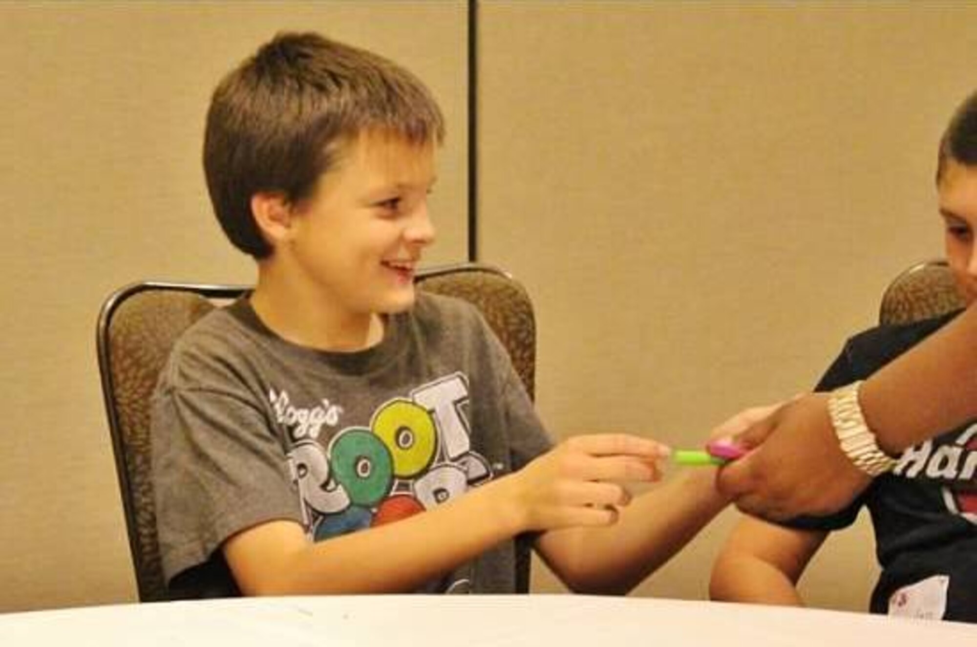 Kevin Swarz, son of Maj. Shawn Swarz and his wife, Michaela, participates in a youth activity Nov. 23, 2013, during an Air Force Reserve Yellow Ribbon Program reintegration training event in Orlando, Fla. Kevin and his older brother, Michael, have endured multiple separations from their father, commander of the Reserve's 315th Security Forces Squadron, Joint Base Charleston, S.C. (U.S. Air Force photo by Tech. Sgt. Rachael Garneau)