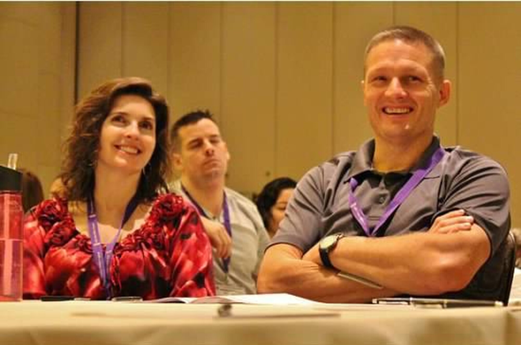 Maj. Shawn Swarz, commander of the 315th Security Forces Squadron at Joint Base Charleston, S.C., and his wife, Michaela, listen to a briefing during an Air Force Reserve Yellow Ribbon Program reintegration training event Nov. 23, 2013, in Orlando, Fla. The couple has endured seven separations caused by the major's military service dating back to Operation Desert Storm in 1991. He completed his most recent deployment this year. (U.S. Air Force photo by Tech. Sgt. Rachael Garneau)