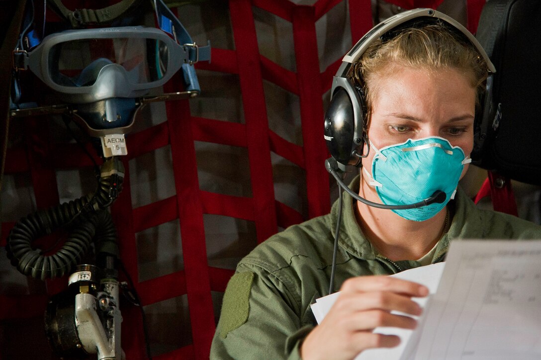 U.S. Air Force Tech. Sgt. Desiree Matlock an aeromedical evacuation technician with the 452nd Aeromedical Evacuation Squadron March ARB Calif., reviews a patients medical report, during an inflight medical training scenario on a C-130 Hercules cargo plane July 27, 2013. Sgt. Matlock is participating in Warrior Exercise 86-13-01 (WAREX)/Exercise Global Medic, 2013,. WAREX provides units an opportunity to rehearse military maneuvers and tactics. Held in conjunction with WAREX, Global Medic is an annual joint-field training exercise designed to replicate all aspects of theater combat medical support." (U.S. Air Force photo by Tech. Sgt. Efren Lopez)