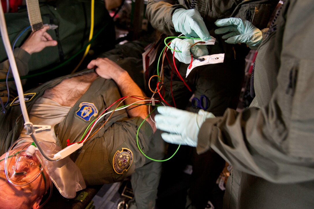 U.S. Air Force Senior Master Sgt. Garry Sheets an observer controller with the 911th Aeromedical Evacuation Squadron, Pittsburg International Airport Air Reserve Station, Coraopolis, Pa., plays the part of a sick patient during an inflight medical training scenario July 27, 2013. Sgt., Sheets is participating in Warrior Exercise 86-13-01 (WAREX)/Exercise Global Medic, 2013,. WAREX provides units an opportunity to rehearse military maneuvers and tactics. Held in conjunction with WAREX, Global Medic is an annual joint-field training exercise designed to replicate all aspects of theater combat medical support." (U.S. Air Force photo by Tech. Sgt. Efren Lopez /Released)