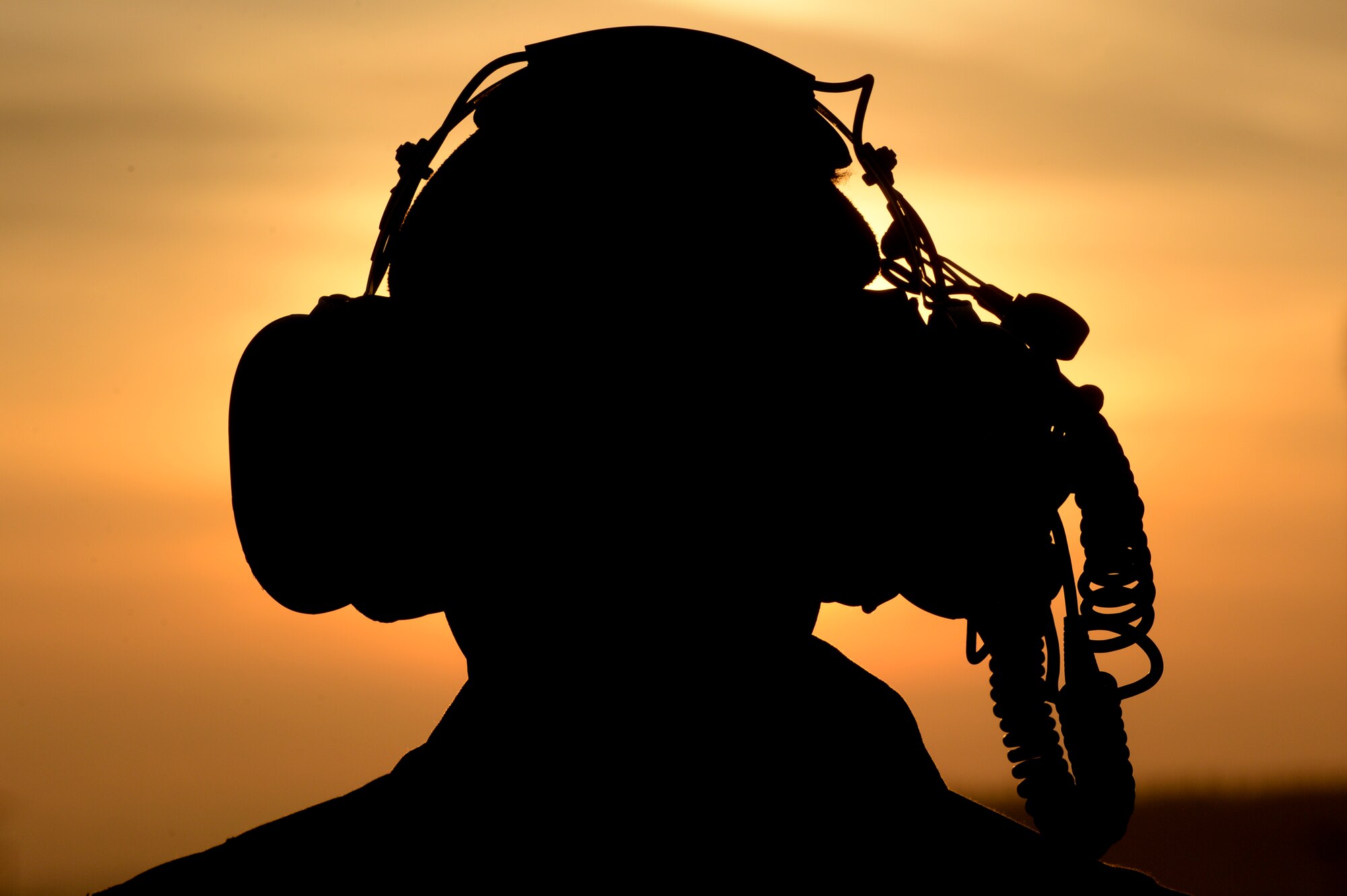 SPANGDAHLEM AIR BASE, Germany -- U.S. Air Force Senior Airman Mike Springer, a 726th Air Mobility Squadron communications/navigation mission system technician, from Shepherdstown, W. Va., looks on the base's flightline during a sunrise Dec. 3, 2013. Spangdahlem Air Base deploys and maintains the F-16, and TPS-75 radar systems. (U.S. Air Force photo by Senior Airman Rusty Frank/Released)