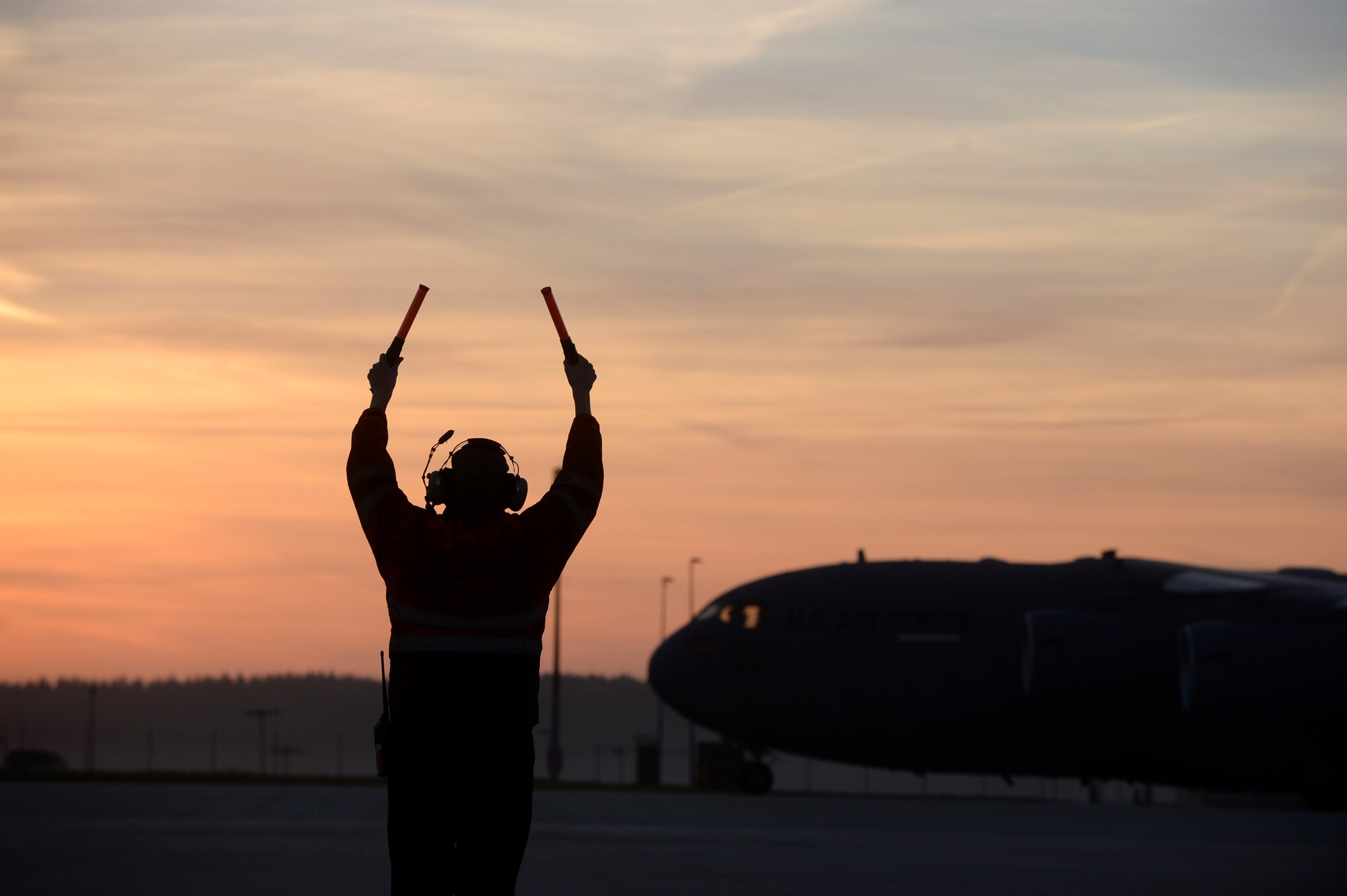 SPANGDAHLEM AIR BASE, Germany -- U.S. Air Force Senior Airman Craig Fox, a 726th Air Mobility Squadron hydraulics maintainer from Glen Burnie, Md.,  marshalls a C-17 Globemaster III cargo aircraft Dec. 3, 2013. The C-17 is the newest aircraft to enter the Air Force's air mobility fleet. (U.S. Air Force photo by Senior Airman Rusty Frank/Released)