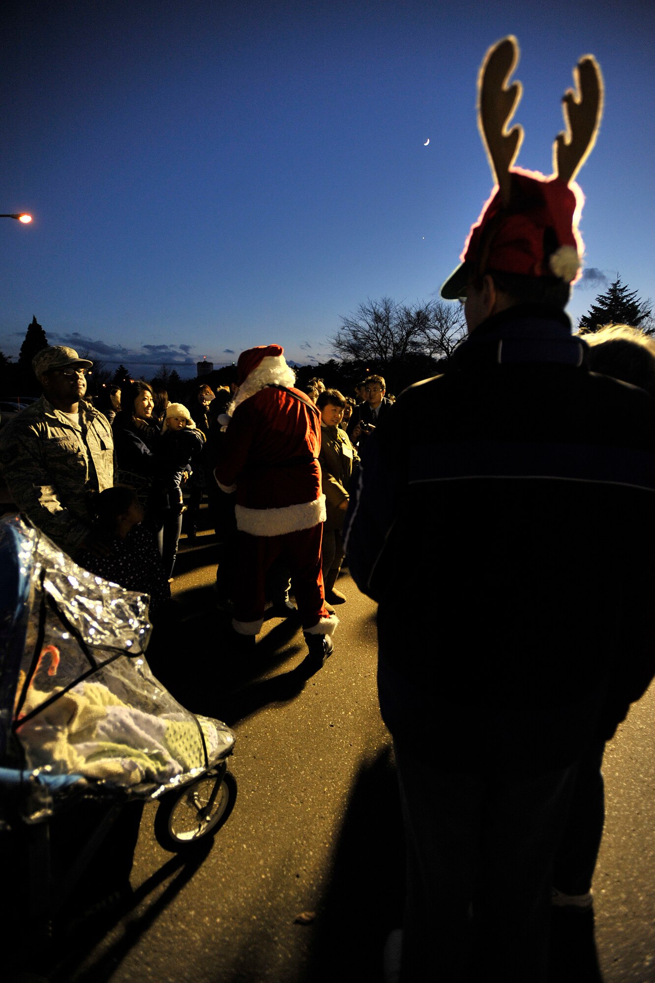 Santa Clause, Elves and Reindeers were present during the annual tree lighting ceremony at Misawa Air Base, Japan, Dec. 6, 2013, at Misawa Air Base, Japan. More than 500 family members enjoyed carols, hot chocolate and watched the judging of more than 40 squadron holiday cards. (U.S. Air Force photo by Staff Sgt. Tong Duong)
