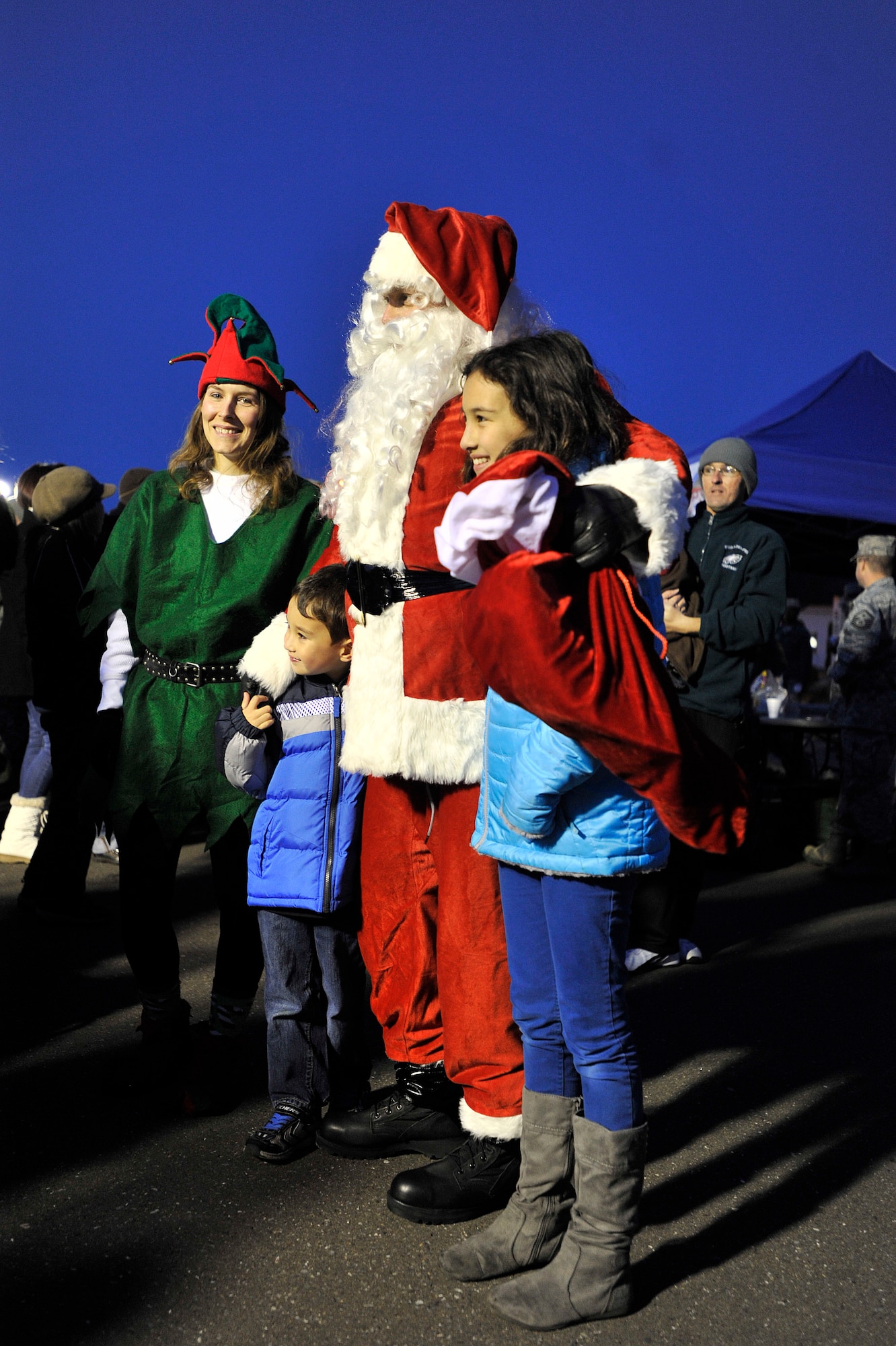 More than 500 family members attended the annual tree lighting ceremony and holiday card competition at Risner Circle, Dec. 6, 2013, at Misawa Air Base, Japan. The event allowed family members to enjoy carol from the base elementary students. (U.S. Air Force photo by Staff Sgt. Tong Duong)