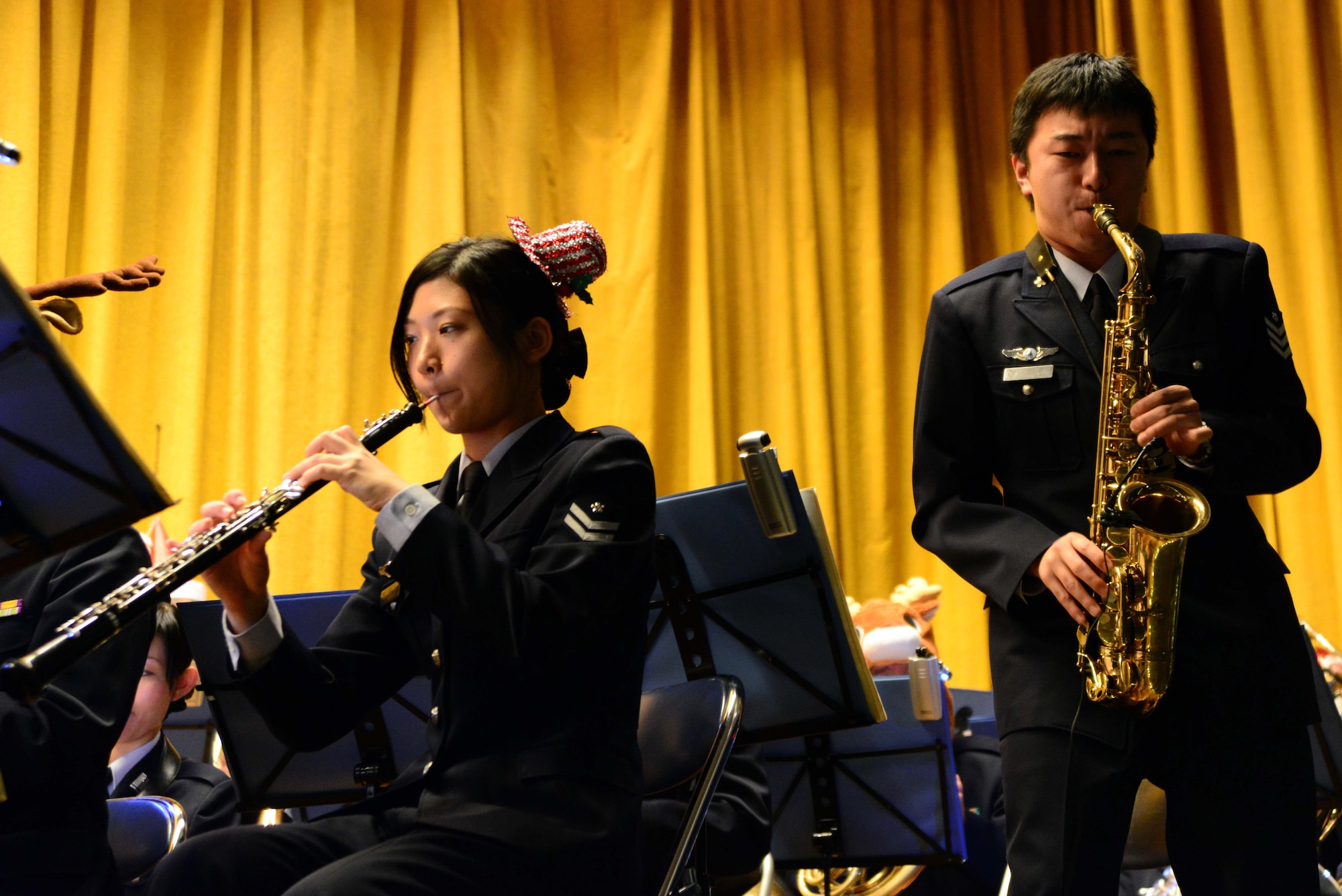 Members of the Northern Air Defense Force band play during a free holiday concert at Misawa Air Base, Japan, Dec. 7, 2013. The concert was open to the base populace and featured 10 compositions of traditional holiday music. (U.S. Air Force photo by Senior Airman Derek VanHorn)