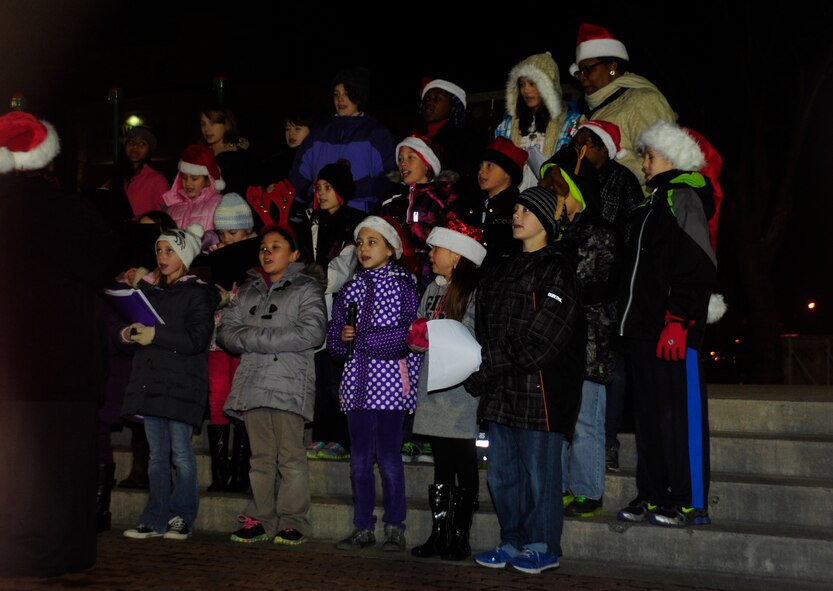 Students and faculty from Sollars Elementary School perform holiday carols during the annual tree lighting ceremony on Misawa Air Base, Japan, Dec. 6, 2013. The tree lighting ceremony kicks off the holiday season for the base. (U.S. Air Force photo by Tech. Sgt. April Quintanilla)