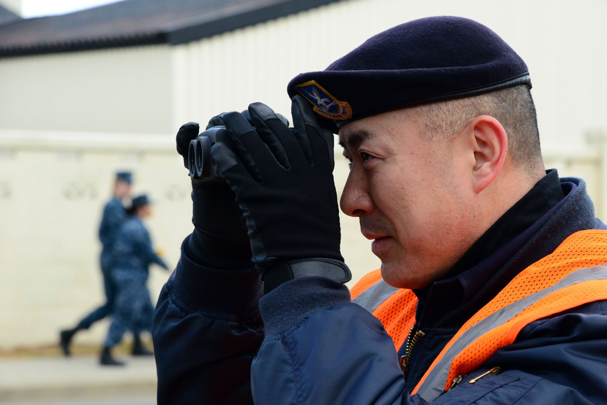 Katsuyoshi Noguchi, a Japanese national civilian guard, uses a light detection and ranging speed measuring device at Misawa Air Base, Japan, Dec. 11, 2013. Noguchi, who has worked at the base for 18 years, was the first of 20 civilian guards slated to be certified on the device by members of the 35th Security Forces Squadron. (U.S. Air Force photo by Senior Airman Derek VanHorn)