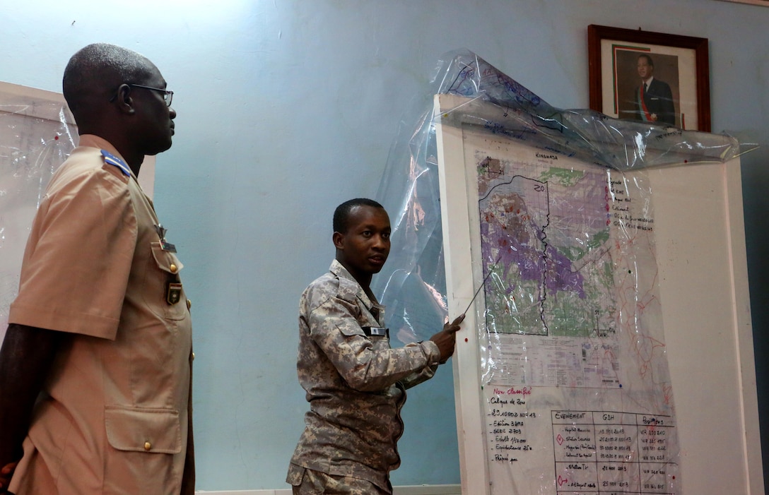 An intelligence analyst from Chad gives his final presentation for the conclusion of the Military Intelligence Noncommissioned Officer’s Course- Africa, Ouagadougou, Burkina Faso,  to his counterparts and instructors, including intelligence professionals from Burkina Faso, Senegal, Niger, Chad and Tunisia. The eight-week Military Intelligence Noncommissioned Officer Course- Africa, instructed by intelligence professionals from the Regional Joint Intelligence Training Facility, Molesoworth, U.K., and led by U.S. Marine Corps Forces Europe and Africa, Stuttgart, Germany, educates and professionally develops partner intelligence professionals to bolster capacity, increase effectiveness, and create trustworthy intelligence analyst within the noncommissioned officer ranks while working with fellow regional, allied and U.S. Africa Command counterparts.