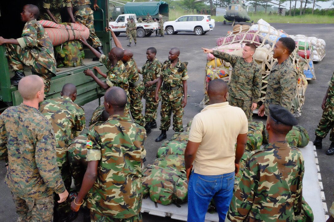 U.S. Marines with Special-Purpose Marine Air-Ground Task Force Africa 13 and Burundi National Defense Force soldiers palletize supplies Dec. 10, 2013, in Bujumbura, Burundi. The Marine of Special-Purpose MAGTF Africa 13 provided logistical support to the Burundi National Defense Force as it prepared to join the African Union mission in the Central African Republic.