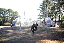 Service members with 2nd Medical Battalion, Combat Logistics Regiment 25, 2nd Marine Logistics Group run towards the sound of chaos during a mass casualty exercise aboard Camp Lejeune, N.C., Dec 12, 2013. Simulated improvised explosive devices detonated, alarms rang out, and fallen comrades screamed in agony as Marines and sailors made their way to the simulated casualties. (U.S. Marine Corps photo by Lance Cpl. Shawn Valosin)