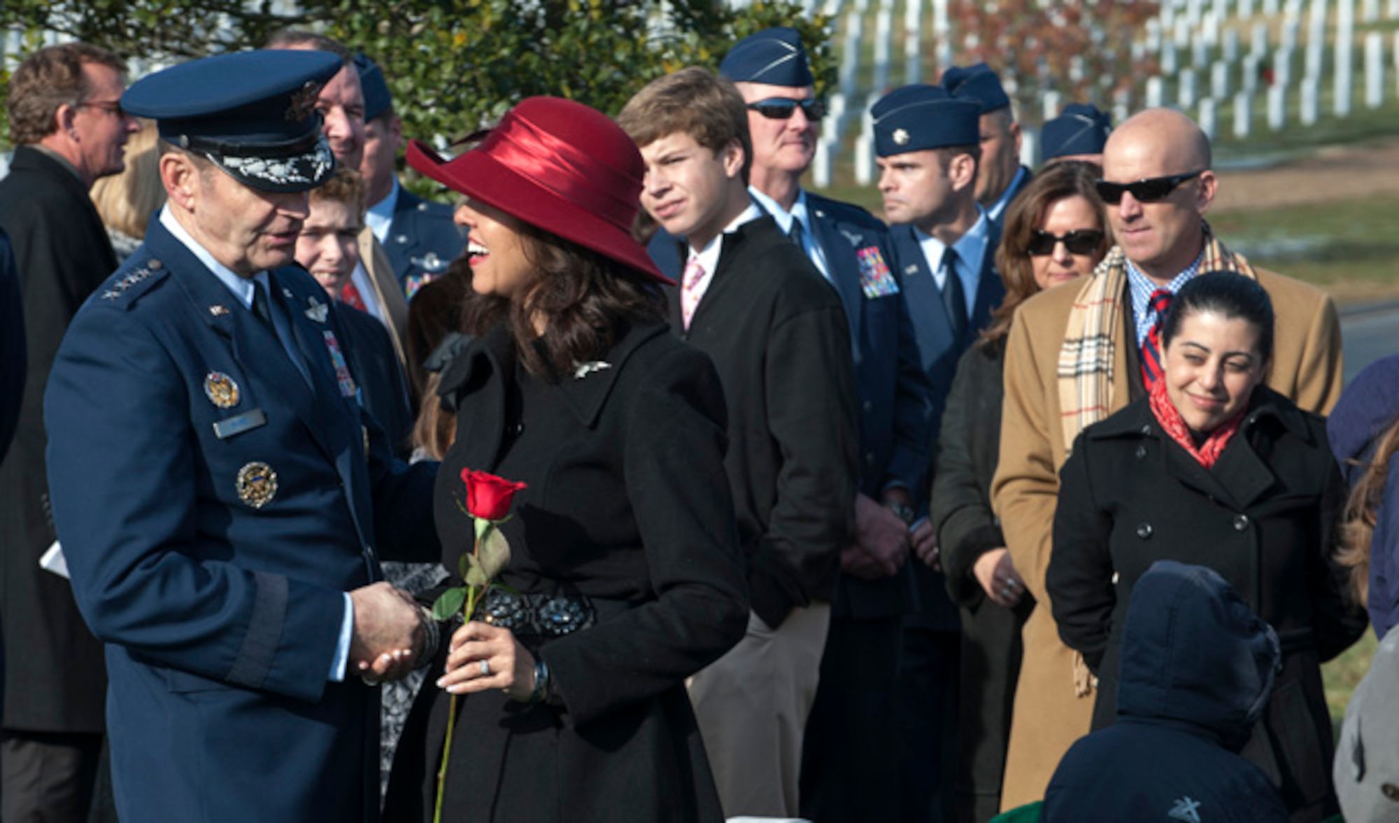 Gen. Robin Rand speaks with Ginger Gilbert Ravella, after her late husband’s, Maj. Troy Gilbert, remembrance funeral Dec. 11, 2013, at Arlington Cemetery, Va. Gilbert was at one time an executive officer for Rand and had flown with him in the past. Rand is the Air Education and Training Command commander. (U.S. Air Force photo/Staff Sgt. Carlin Leslie)