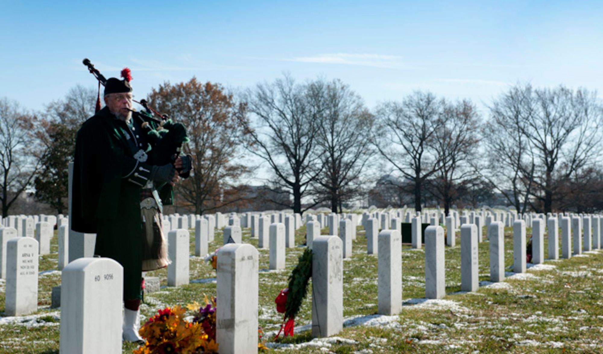 Bagpiper Norm Weaver gives a performance during Maj. Troy Gilberts’ remembrance funeral Dec. 11, 2013, at Arlington Cemetery, Va. Gilbert was an F-16 Fighting Falcon pilot whose aircraft crashed on Nov. 27, 2006 during Operation Iraqi Freedom.  (U.S. Air Force photo/Staff Sgt. Carlin Leslie)