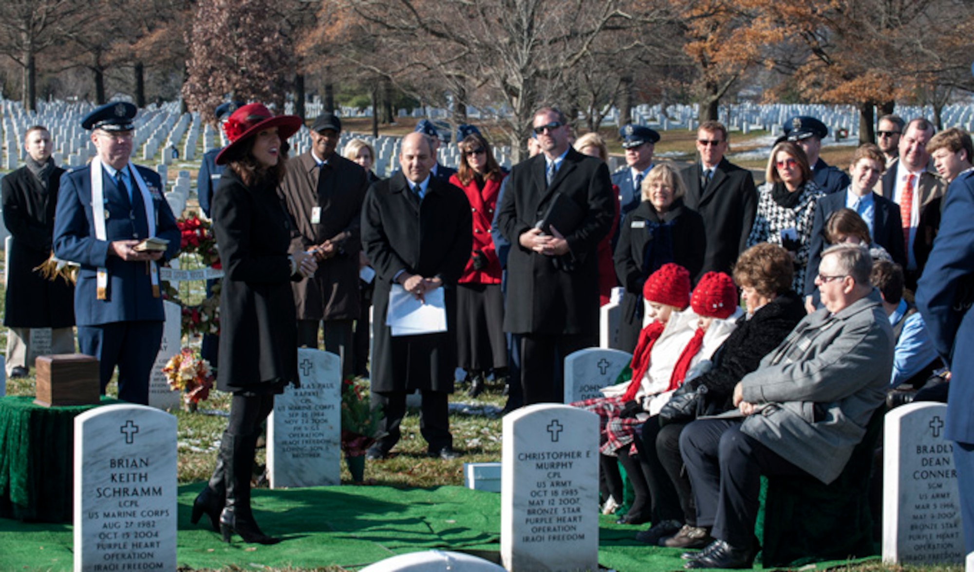 Ginger Gilbert Ravella, speaks during her late husband, Maj. Troy Gilberts’ remembrance funeral  Dec. 11, 2013, at Arlington Cemetery, Va. Gilbert was an F-16 Fighting Falcon pilot whose aircraft crashed on Nov. 27, 2006 during Operation Iraqi Freedom. (U.S. Air Force photo/Staff Sgt. Carlin Leslie)
