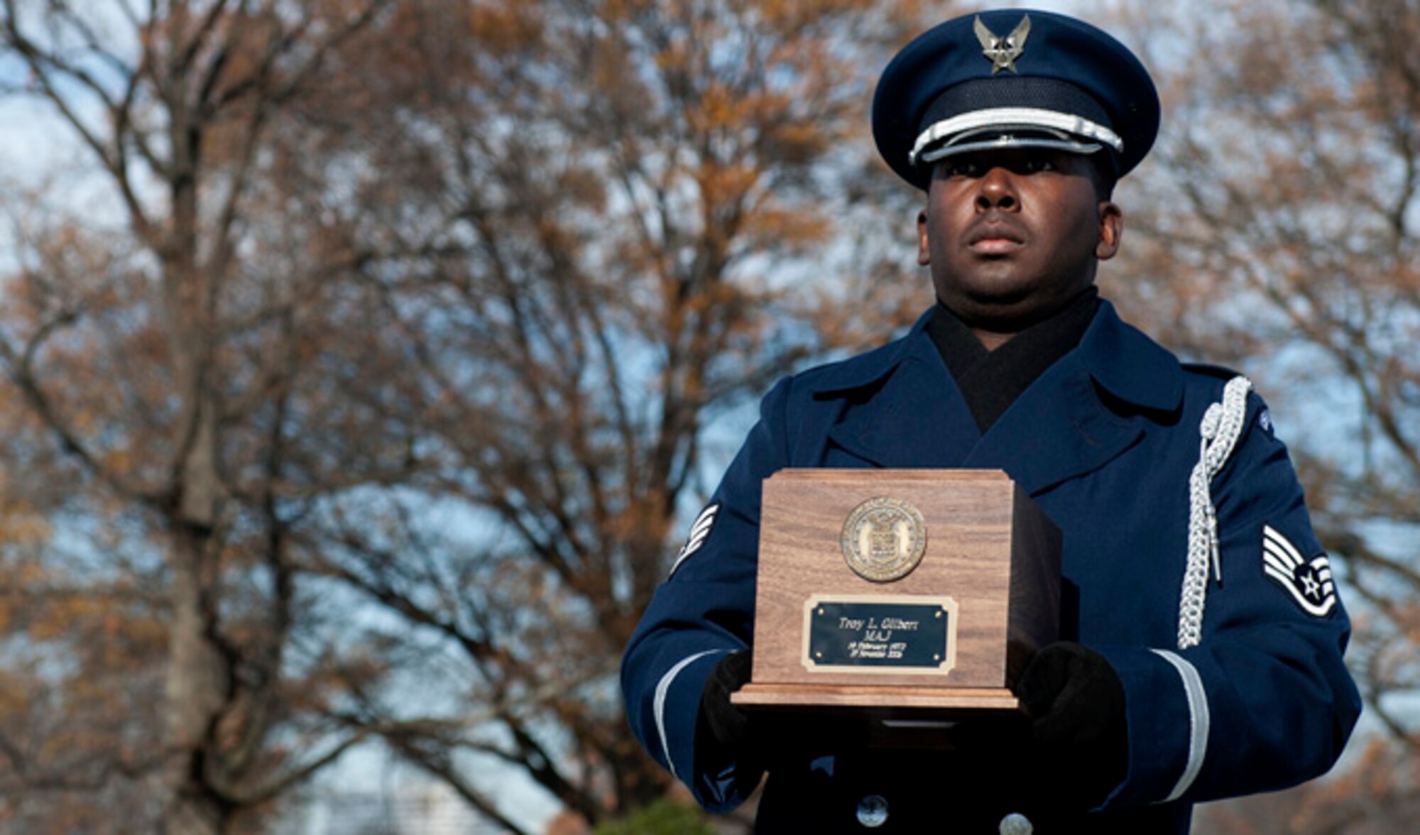 A member of the U. S. Air Force Honor Guard carries the recently recovered remains of Maj. Troy Gilbert, during a remembrance funeral Dec. 11, 2013, at Arlington Cemetery, Va. Gilbert's remains have been interred seven years after his first military burial. (U.S. Air Force photo/Staff Sgt. Carlin Leslie)