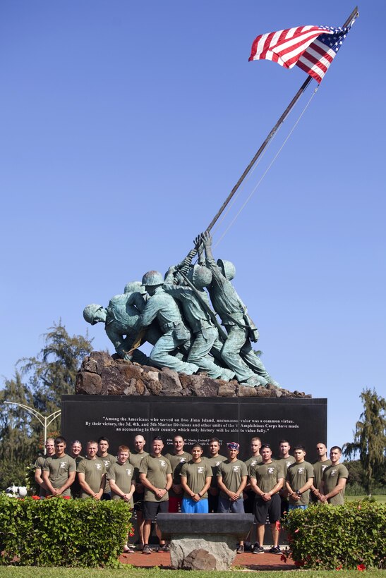 Participating Marines pose for a photo at the Pacific War Memorial, Dec. 6, 2013. Eighteen Marines gathered aboard Marine Corps Base Hawaii at 4 p.m. to trek the 133 miles around the outskirts of Oahu in 24 hours in their “Run around Oahu” charity. The event helped raise awareness and money for the injured Marines Semper Fi Fund. The Semper Fi Fund is a nonprofit organization that helps provide immediate financial assistance and support for injured and critically ill members of the Army, Marine Corps, Navy, Coast Guard, Air Force and reserves. (U.S. Marine Corps photo by Lance Cpl. Janelle Y. Villa)