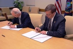 Dr. David Ellison, NIU president, and Assistant Administrator Rodney Benson, chief of intelligence for the U.S. Drug Enforcement Administration, signed a memorandum of agreement Nov. 12 that acknowledged the strategic role of DEA as a member of the intelligence community by establishing the first full-time DEA faculty chair at NIU. 
