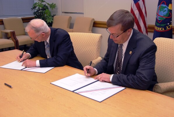 Dr. David Ellison, NIU president, and Assistant Administrator Rodney Benson, chief of intelligence for the U.S. Drug Enforcement Administration, signed a memorandum of agreement Nov. 12 that acknowledged the strategic role of DEA as a member of the intelligence community by establishing the first full-time DEA faculty chair at NIU. 