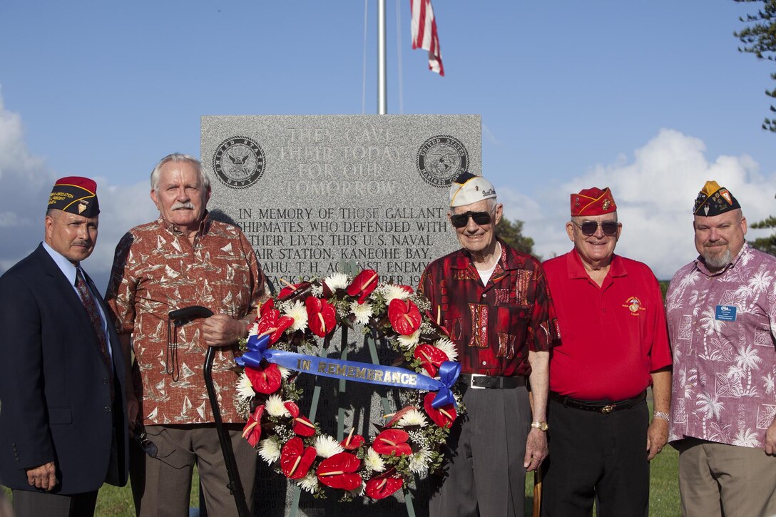 Veterans gather around the Kaneohe Klipper Memorial after the Kaneohe Klipper Memorial Ceremony at the base flagpole, Dec. 6, 2013. Service members and civilians gathered to remember the attacks on Naval Station Pearl Harbor and Naval Air Station Kaneohe Bay 72 years ago. (U.S. Marine Corps photo by Lance Cpl. Suzanna Knotts)