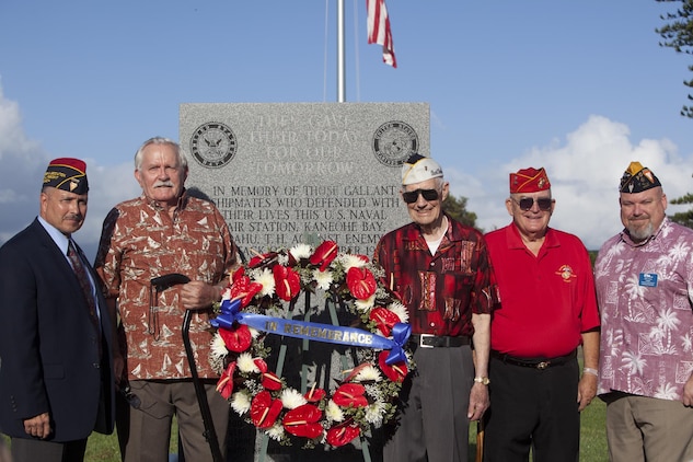 Veterans gather around the Kaneohe Klipper Memorial after the Kaneohe Klipper Memorial Ceremony at the base flagpole, Dec. 6, 2013. Service members and civilians gathered to remember the attacks on Naval Station Pearl Harbor and Naval Air Station Kaneohe Bay 72 years ago. (U.S. Marine Corps photo by Lance Cpl. Suzanna Knotts)