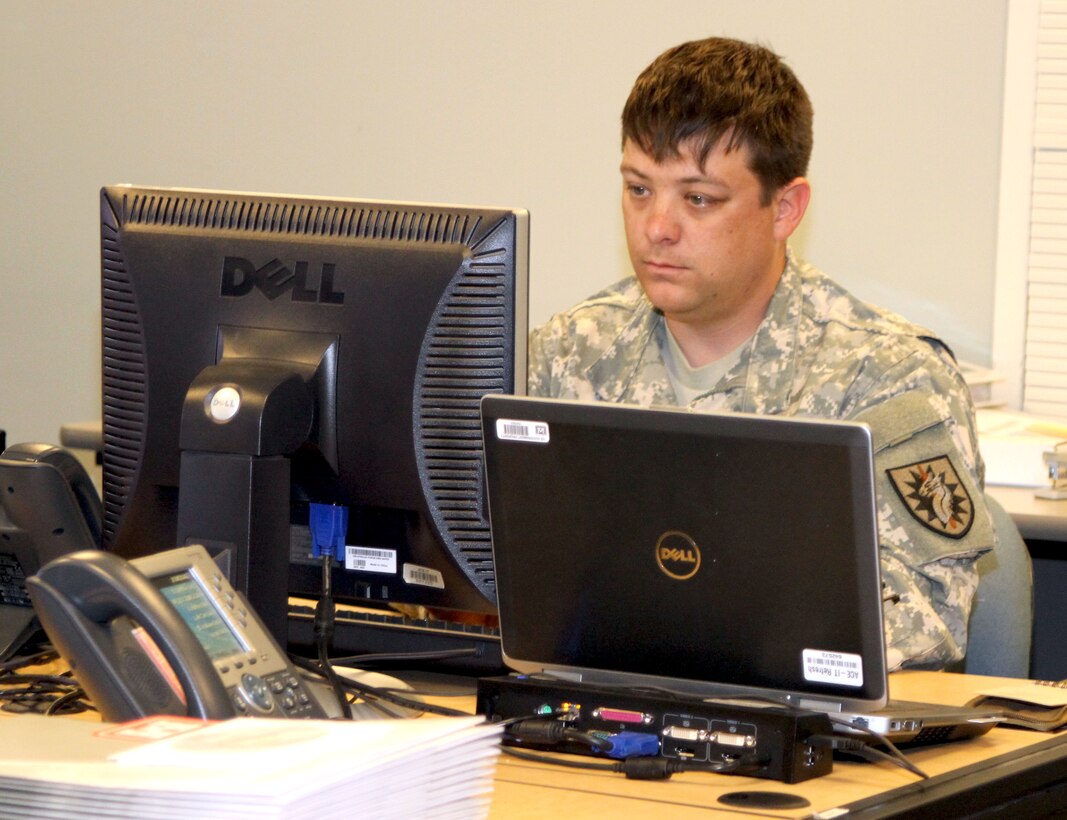 Specialist Christopher Husley, a California National Guardsmen assigned to the District's emergency management office, works in the emergency operations center assisting with a myriad of functions.  Husley began working at the District headquarters in November via the Wounded Warrior Program's Federal Internship component.
