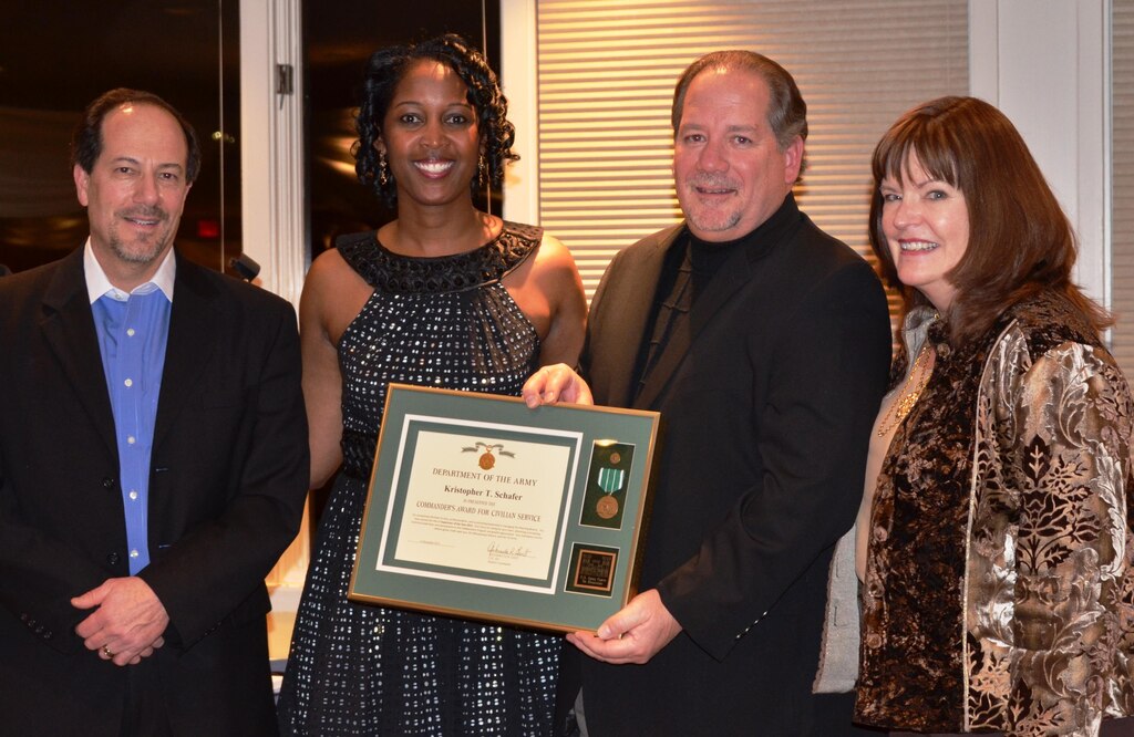 ALBUQUERQUE, N.M., -- Kristopher Schafer, chief, Planning Branch, was recognized as the District Supervisor of the Year during the District’s Winter Ball, Dec. 6, 2013. (l-r): John D’Antonio, Deputy District Engineer and chief Planning, Programs and Project Management Division; Lt. Col. Antoinette Gant; Kris Schafer; Jan Schafer. 