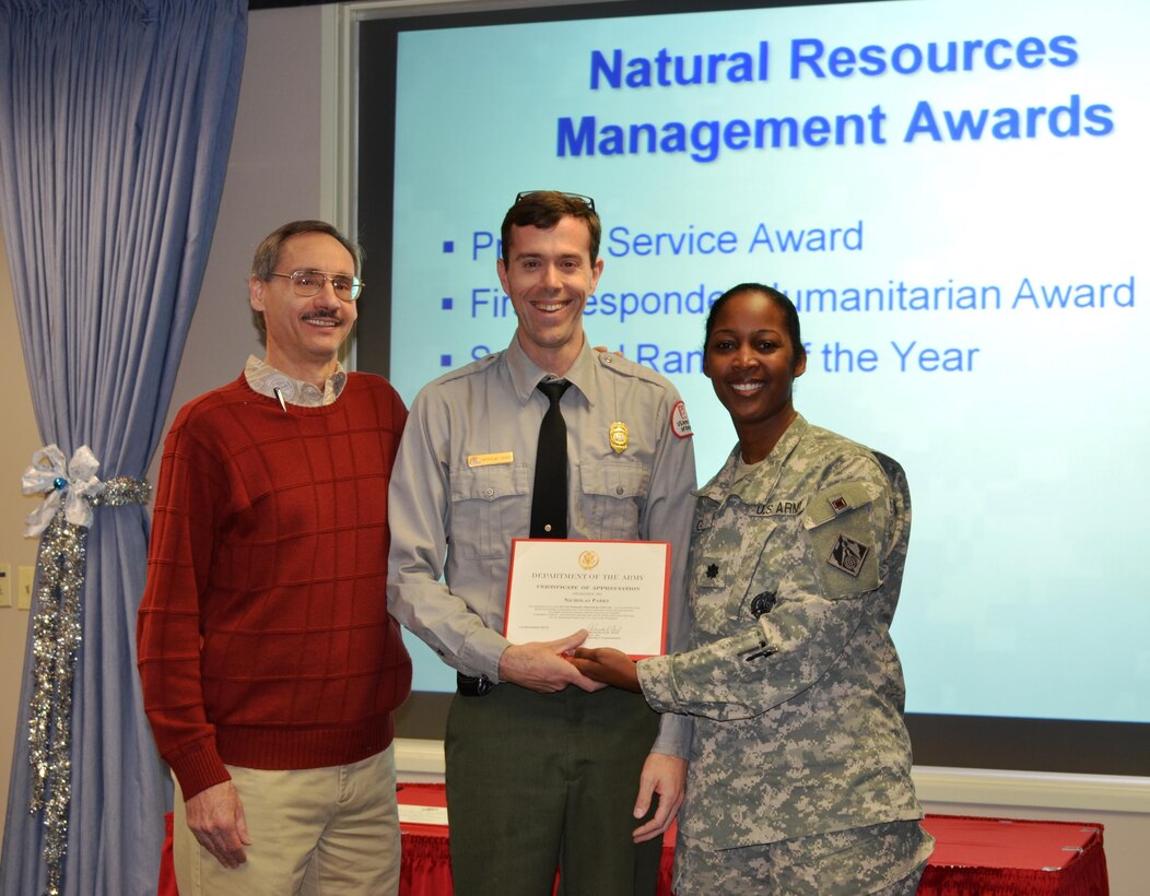 ALBUQUERQUE, N.M., -- Cochiti Park Ranger Nicholas Parks received the First Responder Humanitarian of the Year award during the District's quarterly town hall meeting, Dec. 12, 2013. (l-r): Mark Yuska, Operations Division Chief, Nicholas Parks, District Commander Lt. Col. Antoinette Gant. 