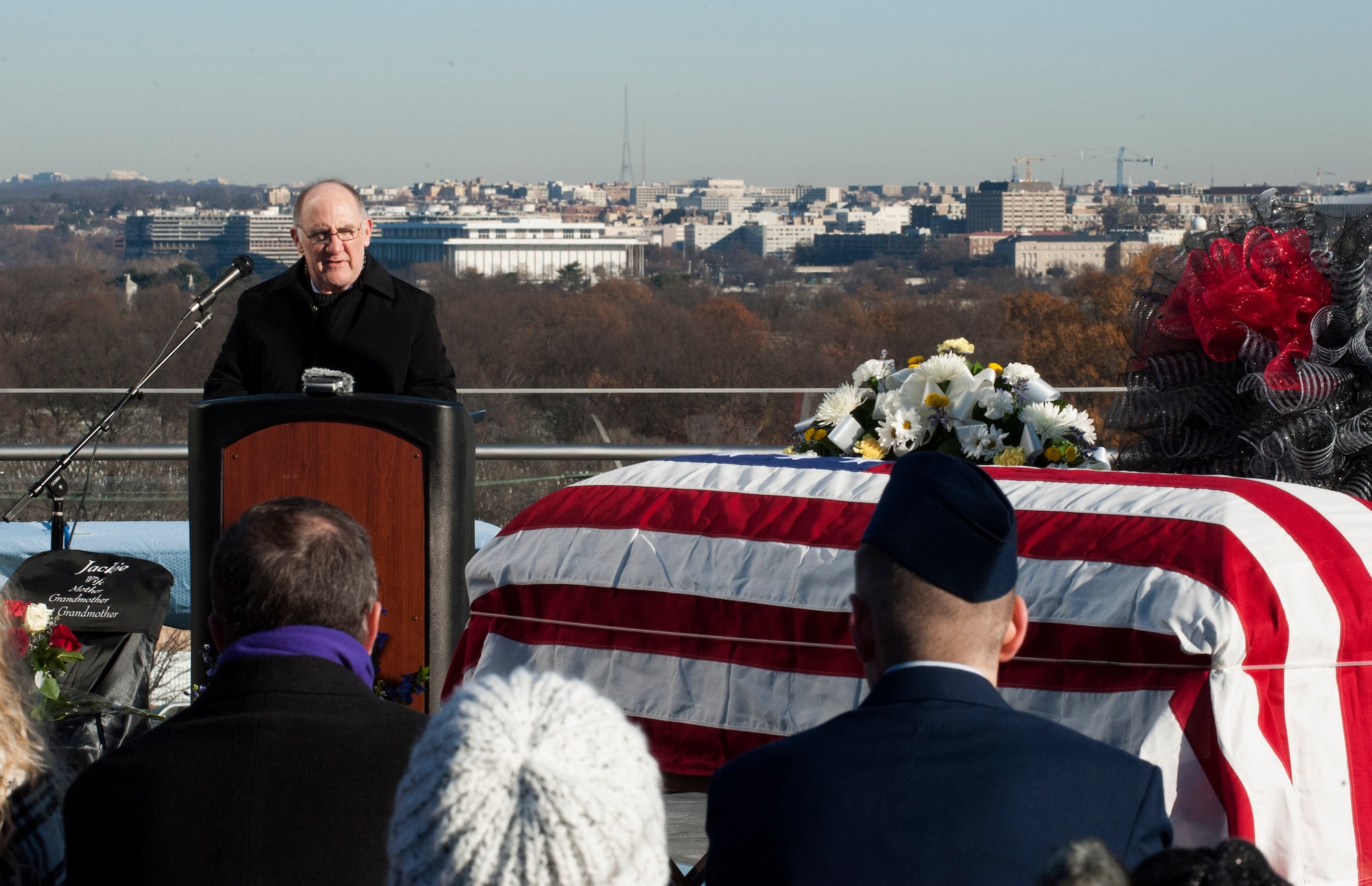 Randal Hill speaks during a celebration of life ceremony for Col. Francis McGouldrick Jr. Dec. 13, 2013, at the Air Force Memorial, Arlington, Va. Hill is the son-in-law of McGouldrick Jr., who was declared missing in action on Dec. 13, 1968 and received a burial with full military honors in Arlington Cemetery. (U.S. Air Force photo/Staff Sgt. Carlin Leslie)